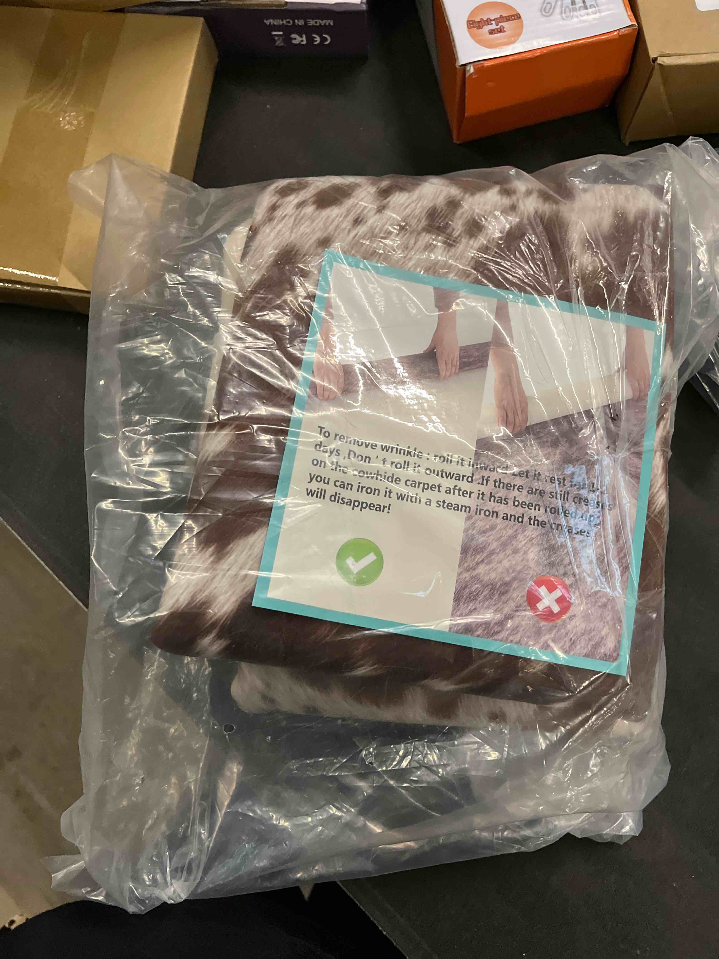 Condition photo showing Good Condition for Easycozy Faux Cowhide Large Cow Print Rug - 4.7 x 5.2 Feet, Thickened Elastic for Bedroom, Living Room, Home Office, Western Decor Brown 5'2" x 4'7" (Irregular)