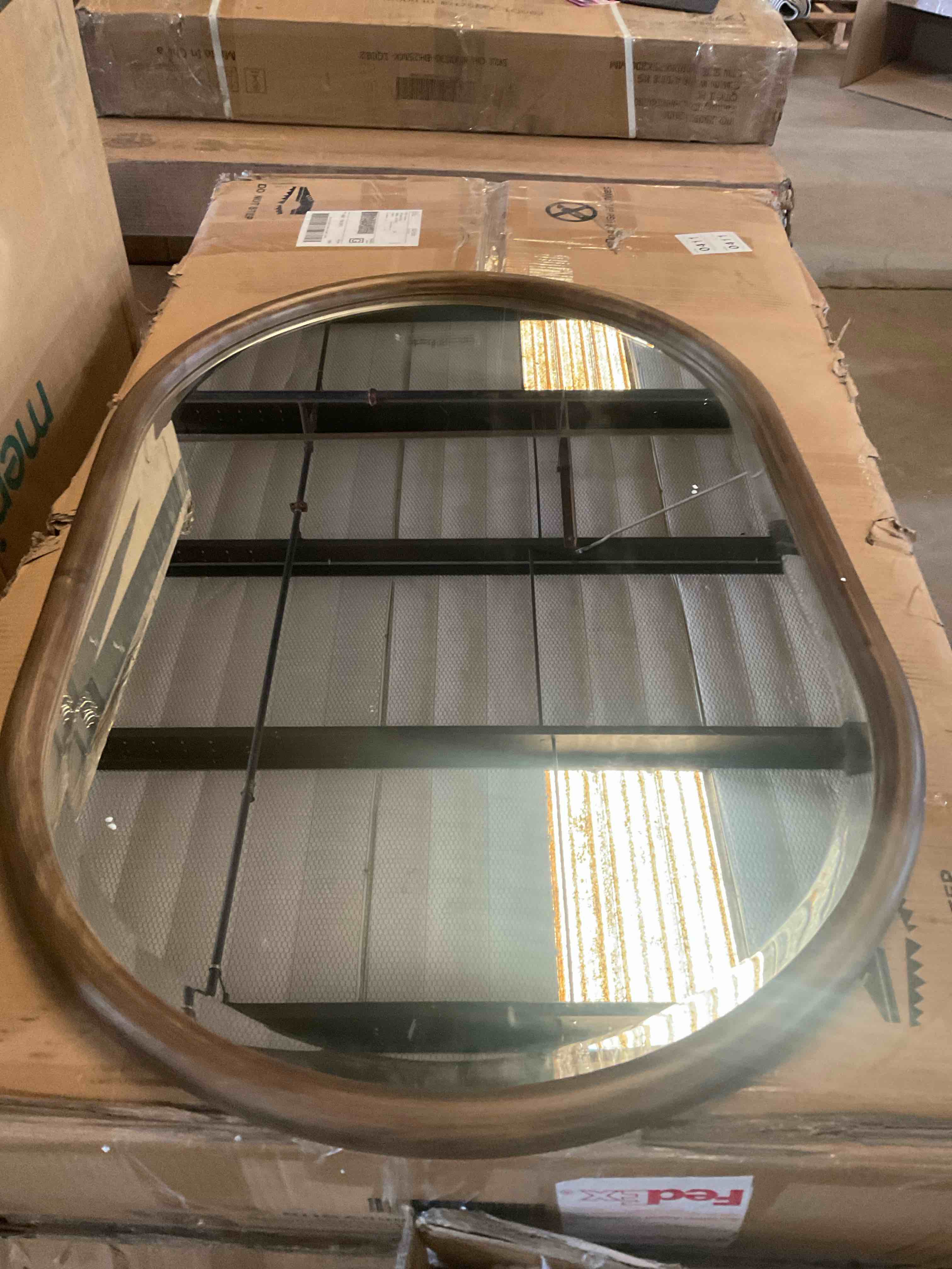 Howard Elliot collection oval mirror