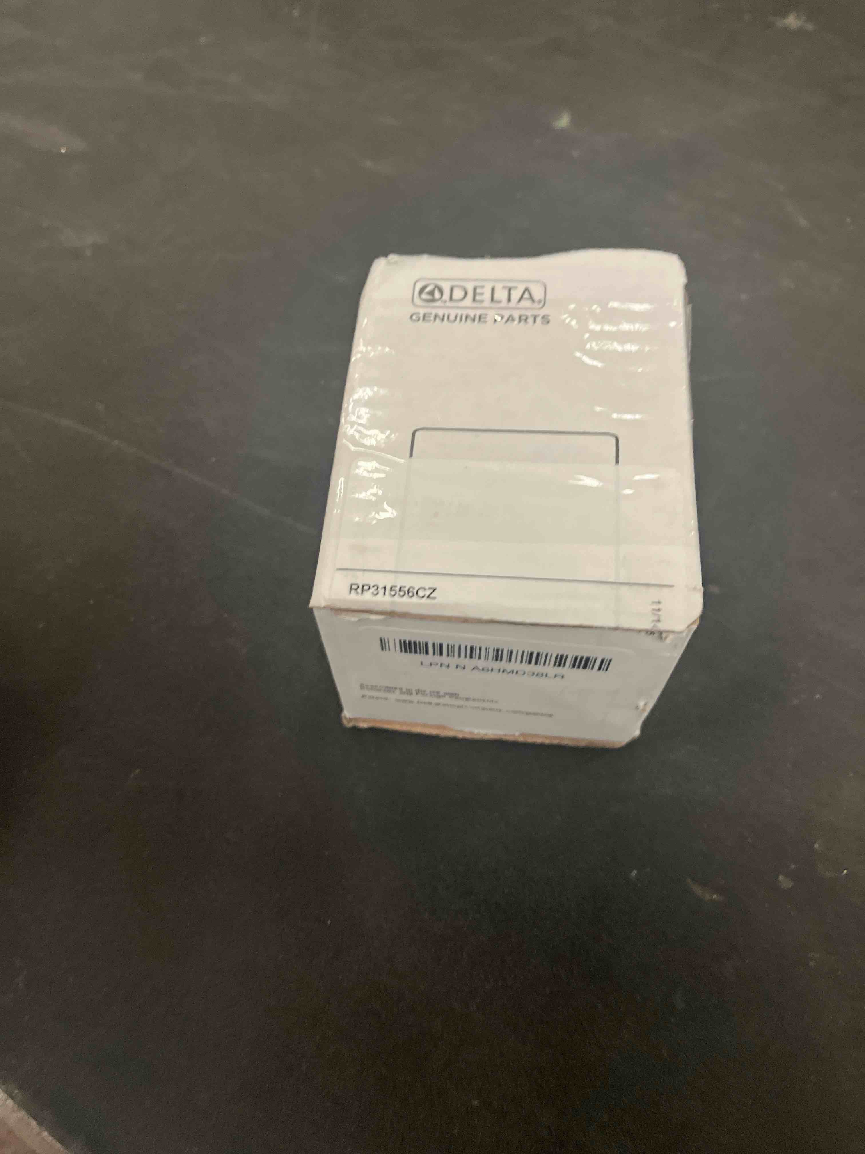 Condition photo showing Good Condition for Delta Faucet RP31556CZ Overflow Plate and Screws, Champagne Bronze