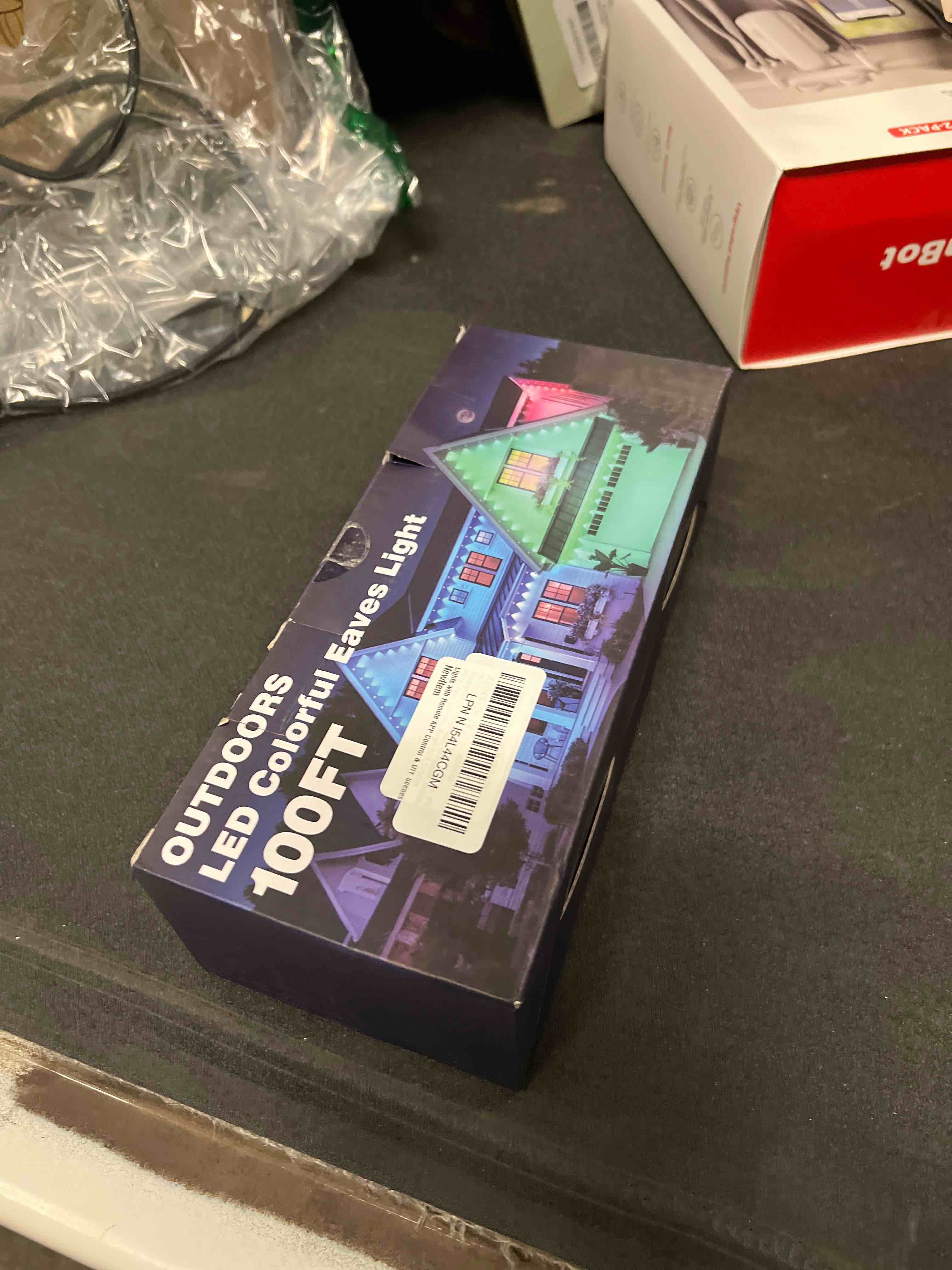 Condition photo showing As Is for 100FT Permanent Outdoor Lights, IP67 Waterproof,for House Roof, Christmas, Holiday, Party, Daily Lighting, Smart RGB Outdoor Lights with Remote APP Control & DIY Scenes