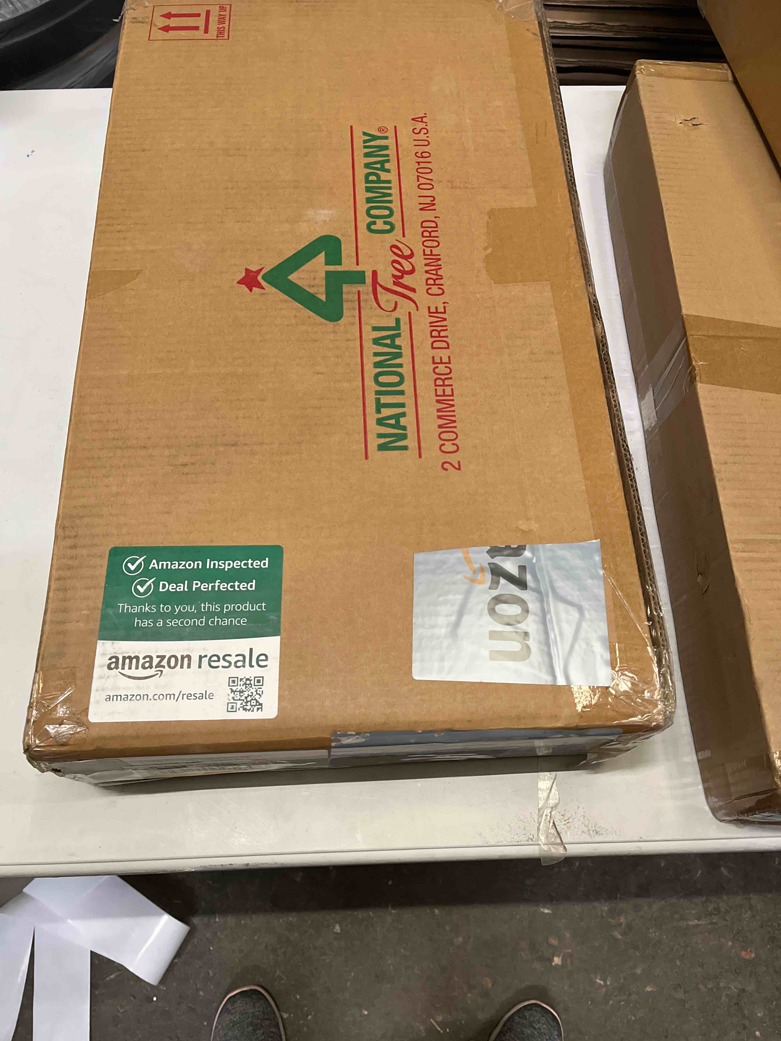 Condition photo showing Good Condition for national tree company 9 ft pre-lit carolina pine artificial christmas garland, christmas decoration with pinecones, 100 warm white led lights, 240 tips, timer, green battery operated tree