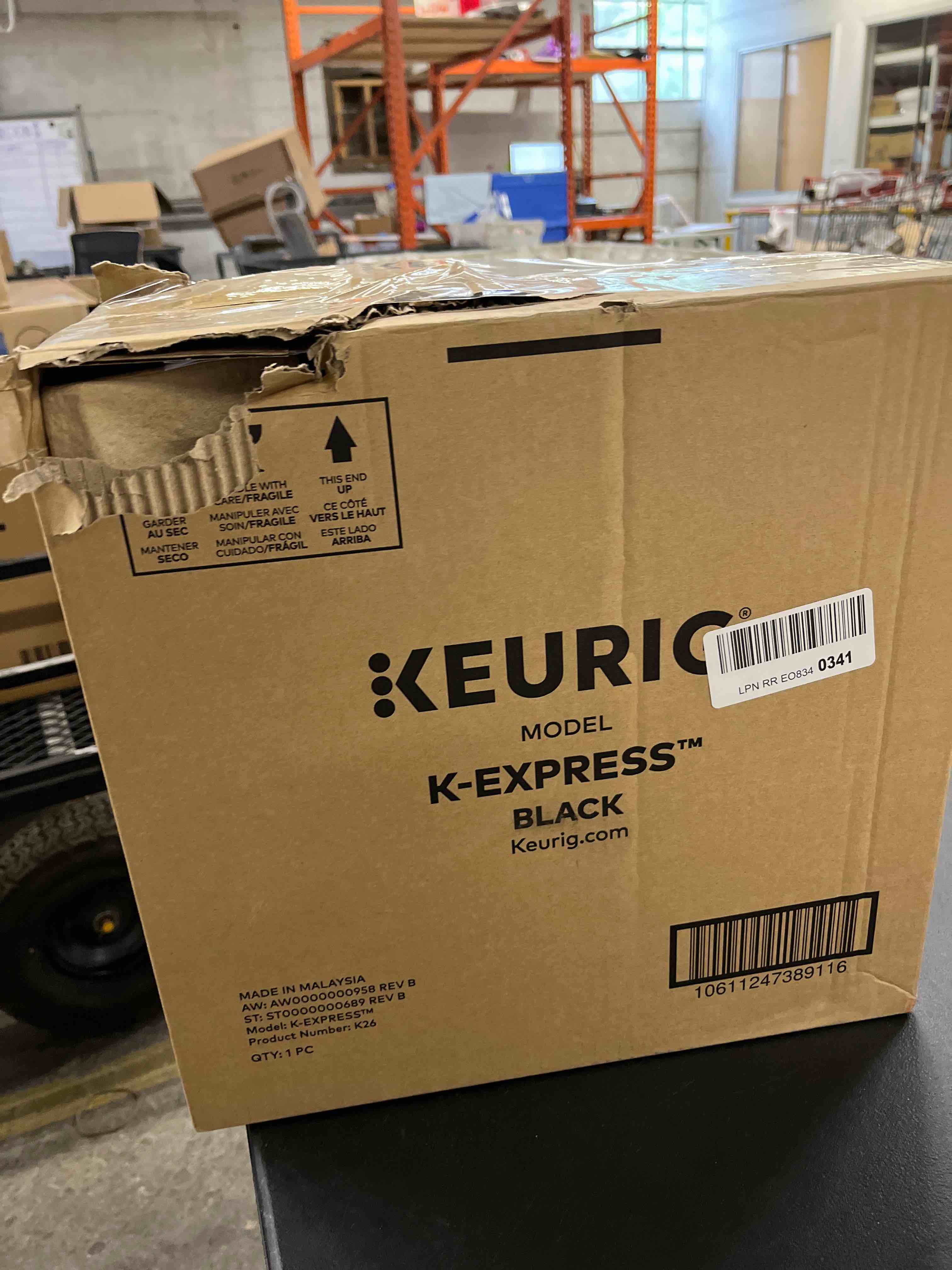 Condition photo showing As Is for (busted water reservoir )keurig k-express single serve k-cup pod coffee maker, 3 brew sizes, strong button feature, 42oz removable reservoir, black