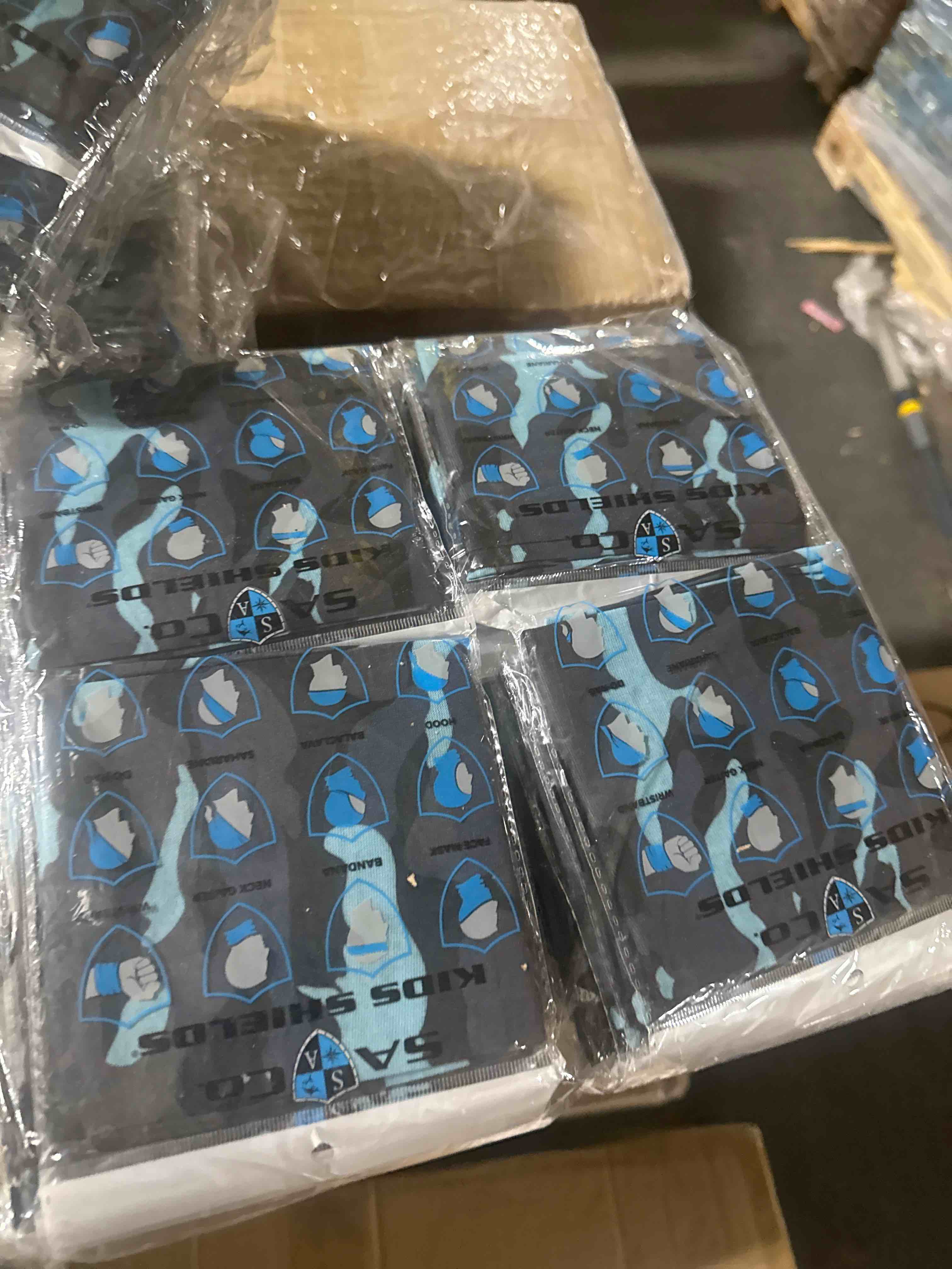 Condition photo showing New/Like New for case of 50 sa kids face mask / neck gaiter aqua camo 