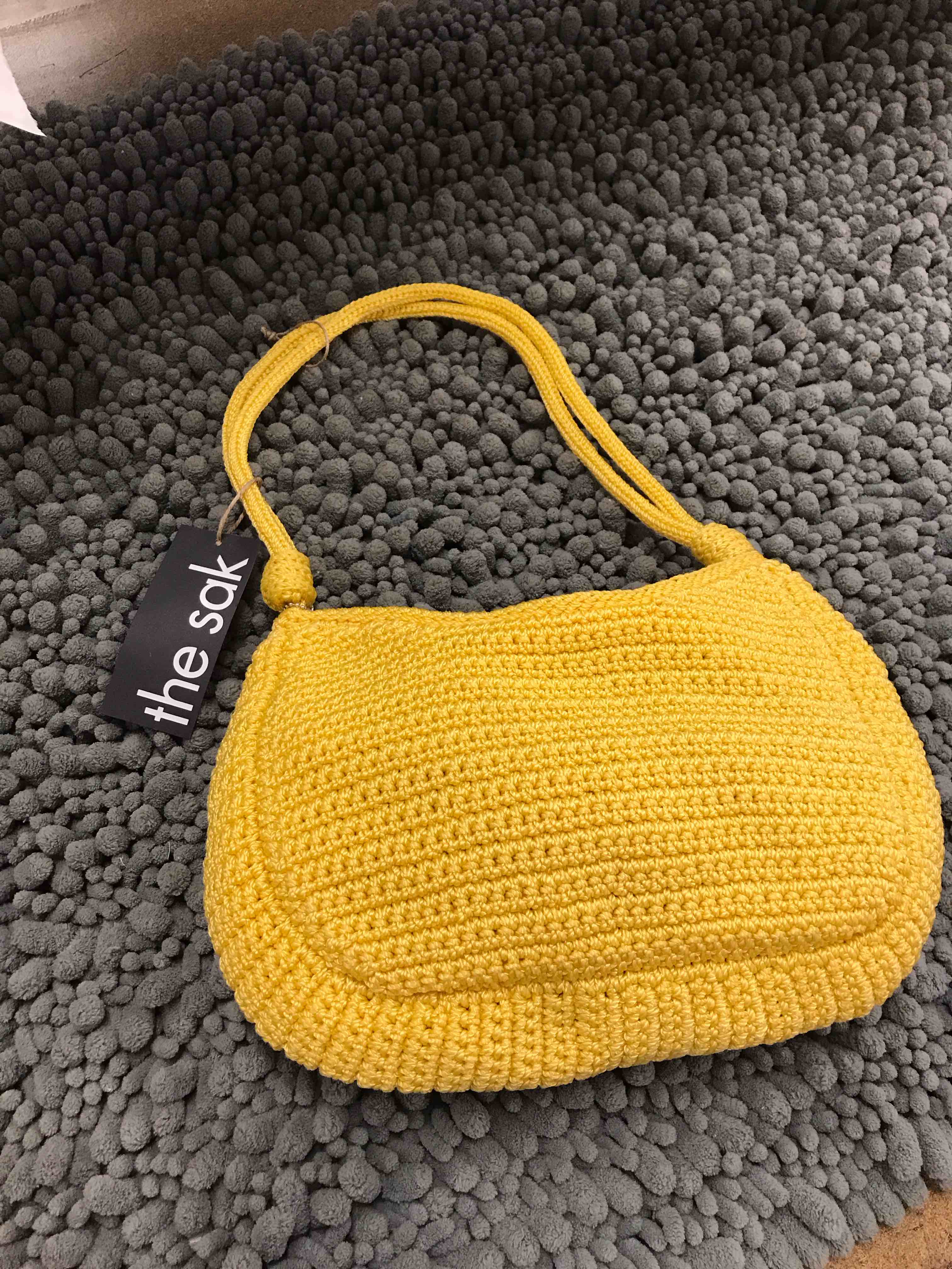 Condition photo showing As Is for the sak yellow purse