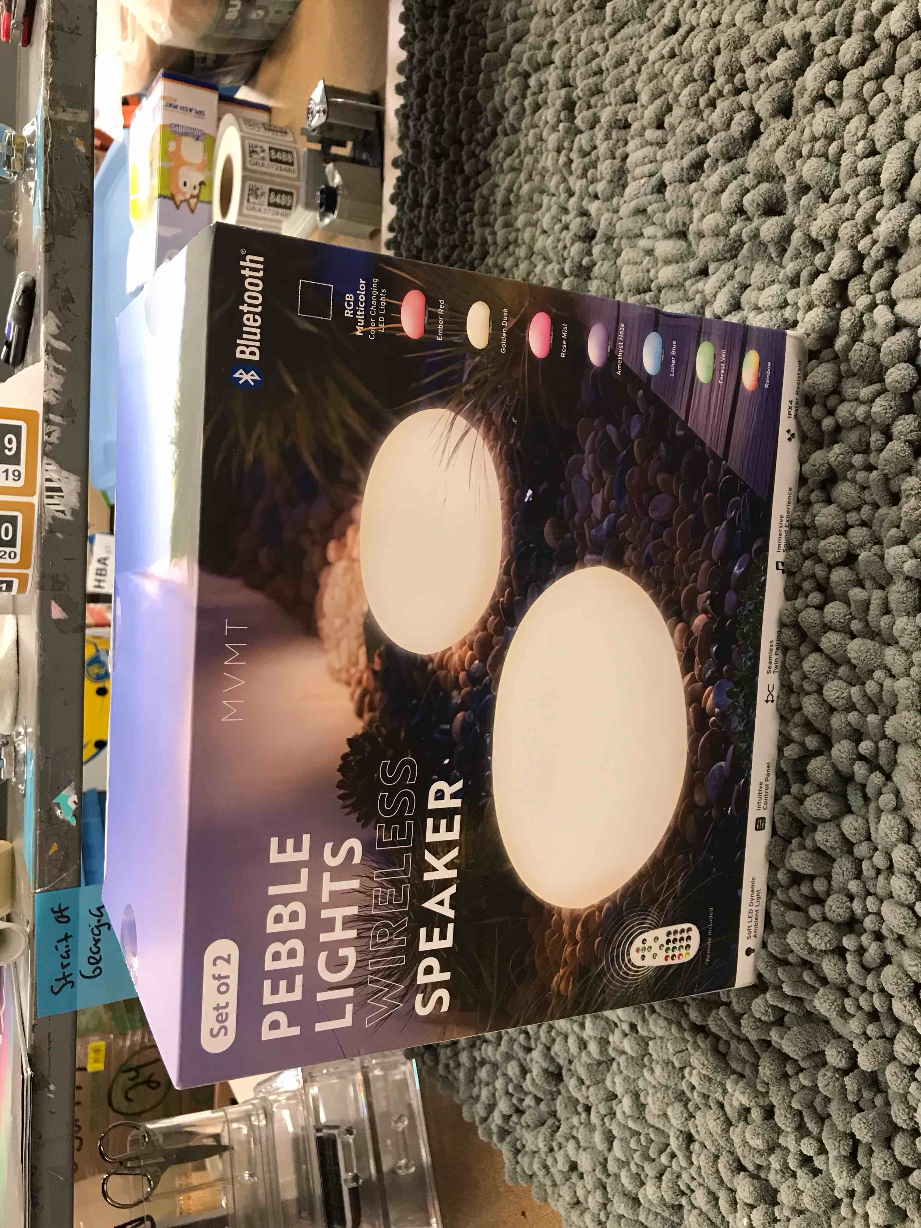 Condition photo showing As Is for pebble lights wireless speaker