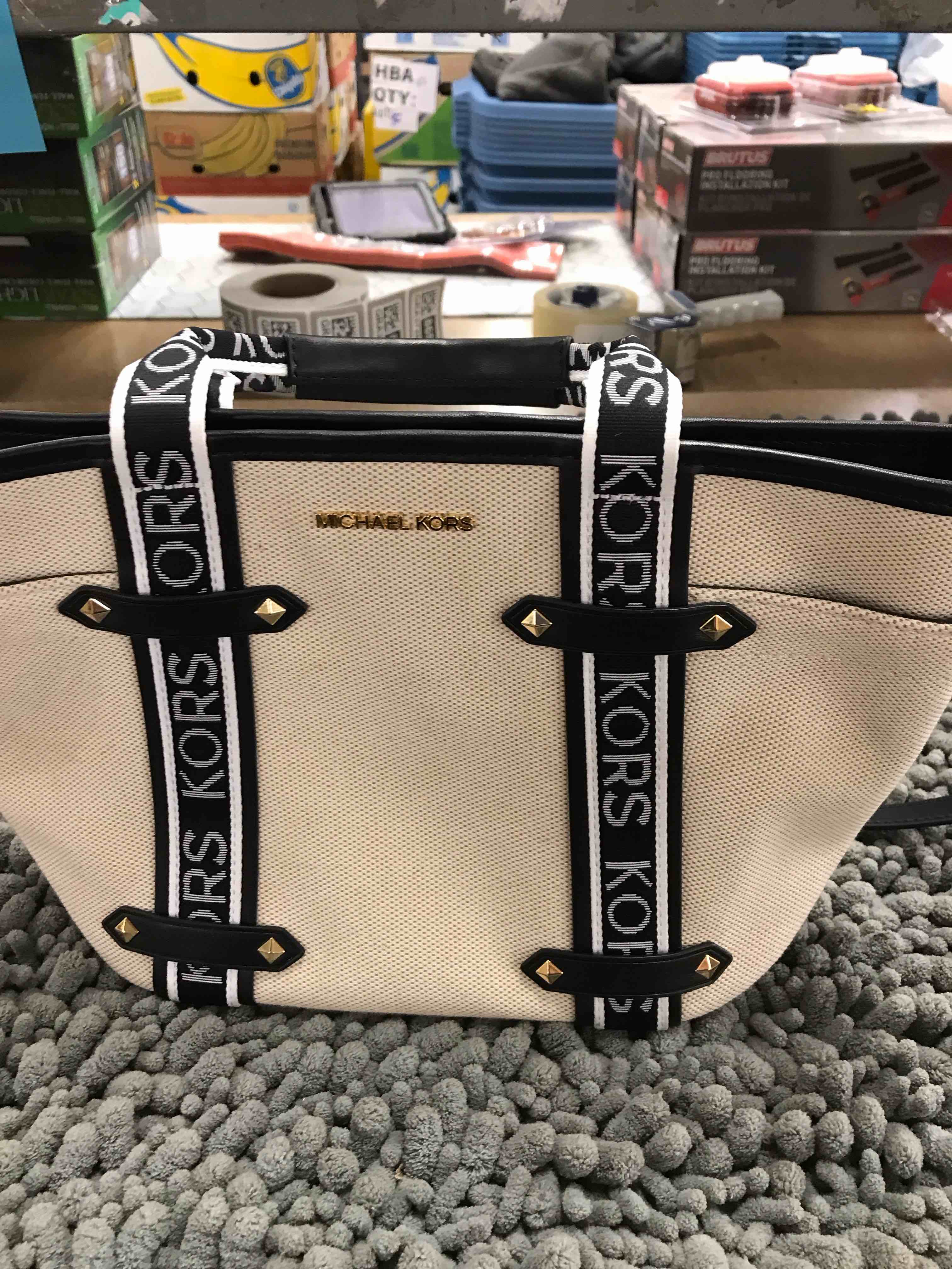 Condition photo showing As Is for Michael Kori’s purse