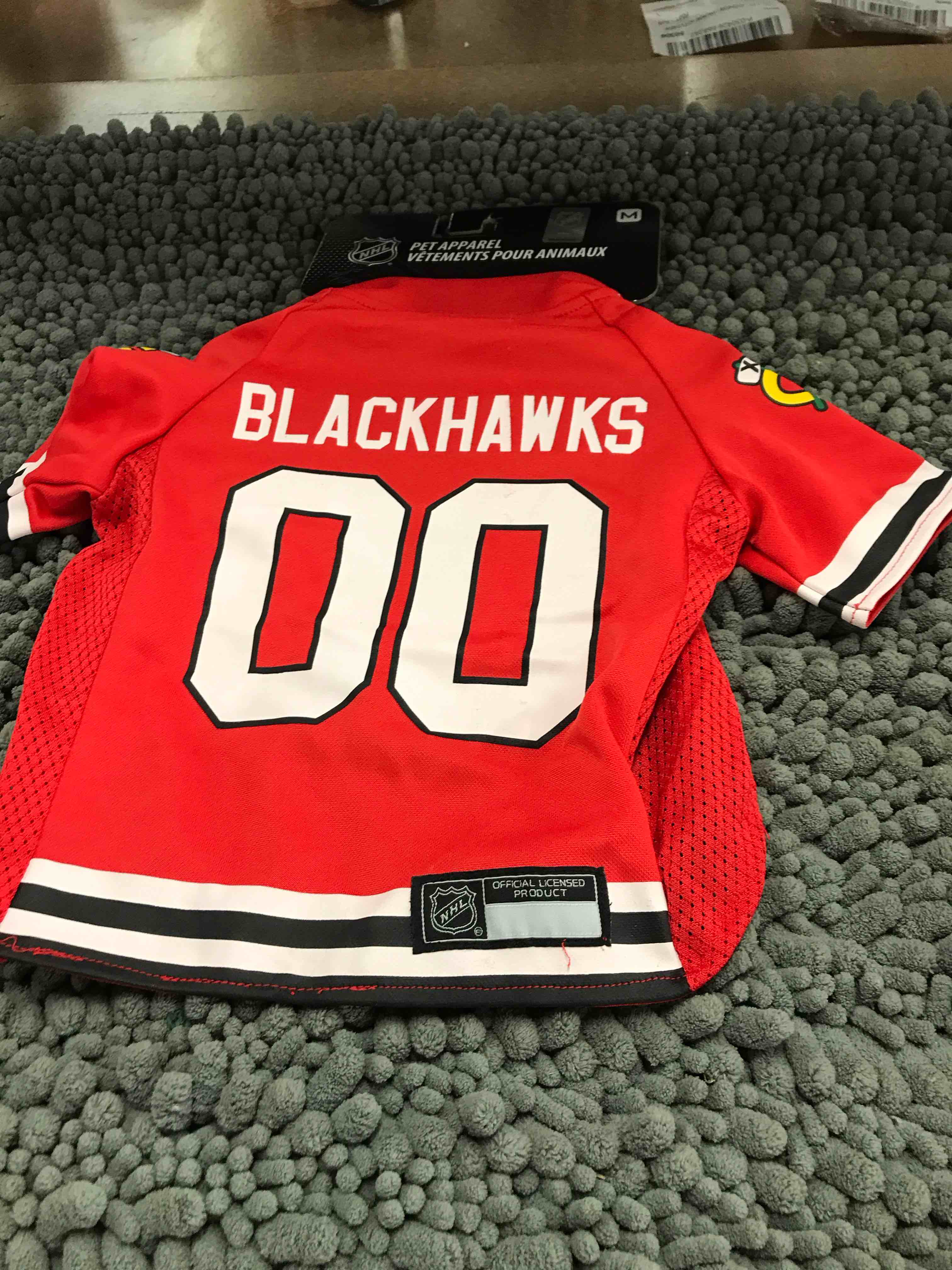 Condition photo showing New/Like New for size medium blackhawks jersey