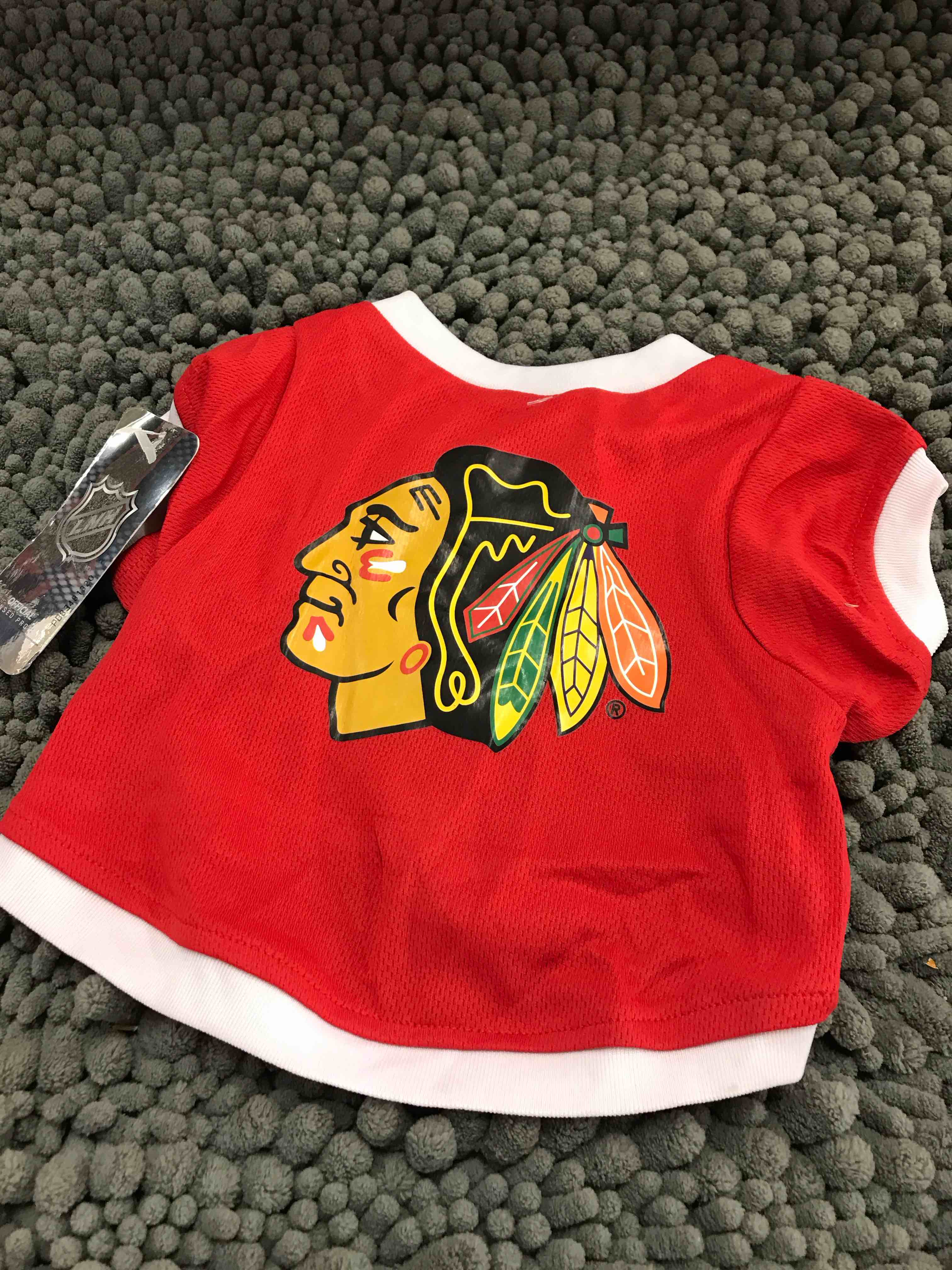Condition photo showing New/Like New for size small Blackhawks dog shirt