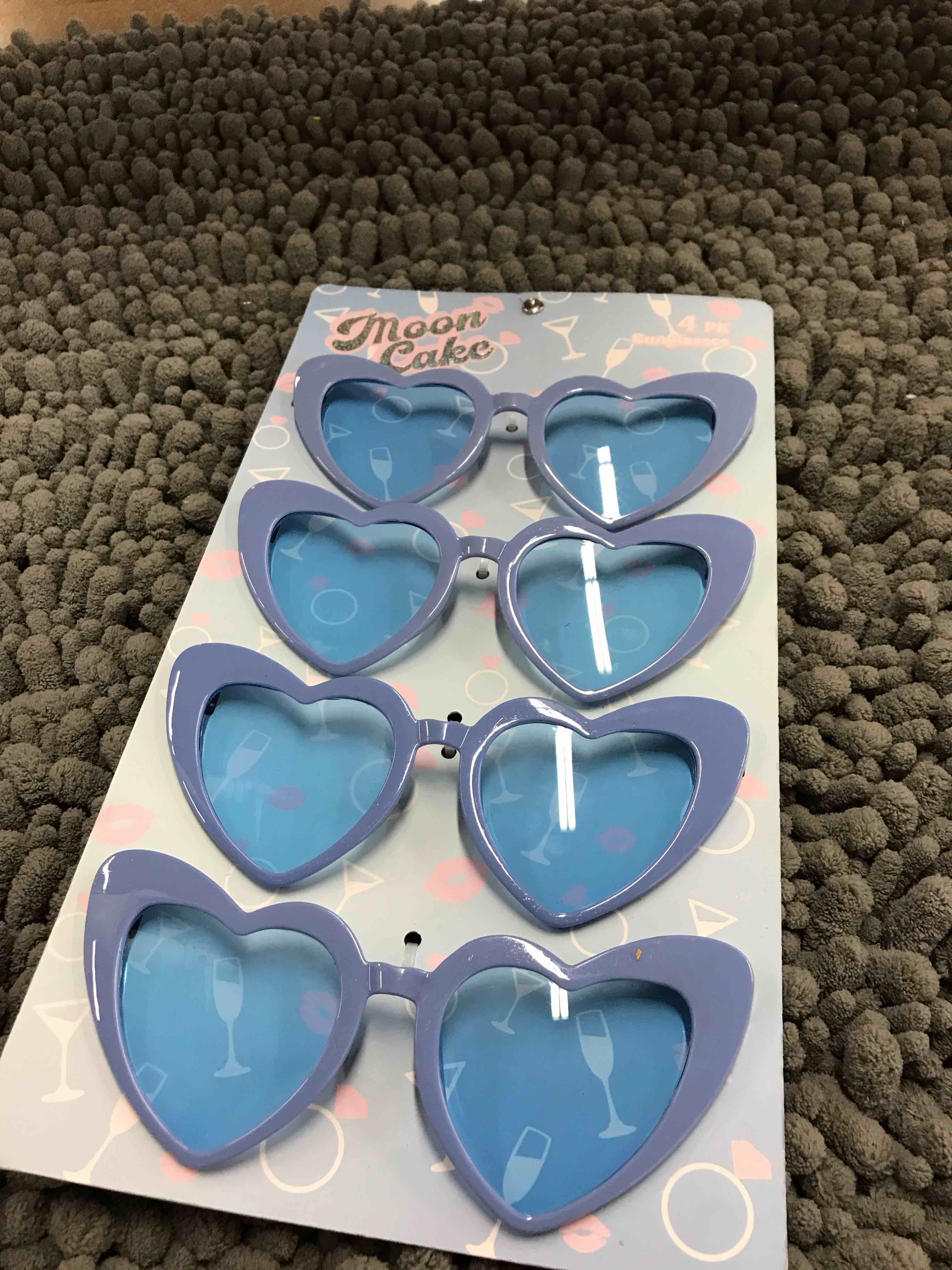 Condition photo showing New/Like New for 4 pack sunglasses