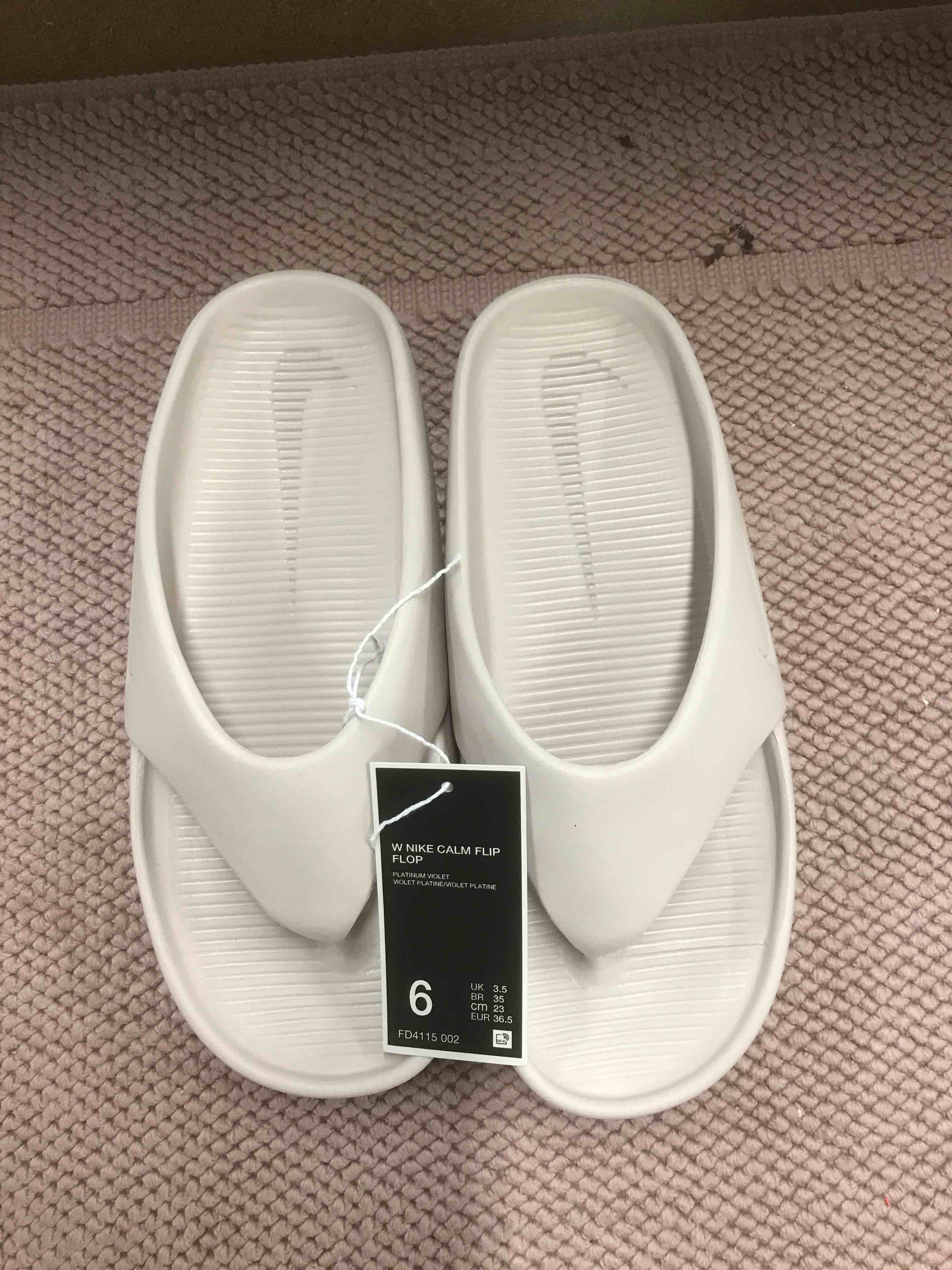 Condition photo showing New/Like New for Nike Women's Calm Flip Flop Slides