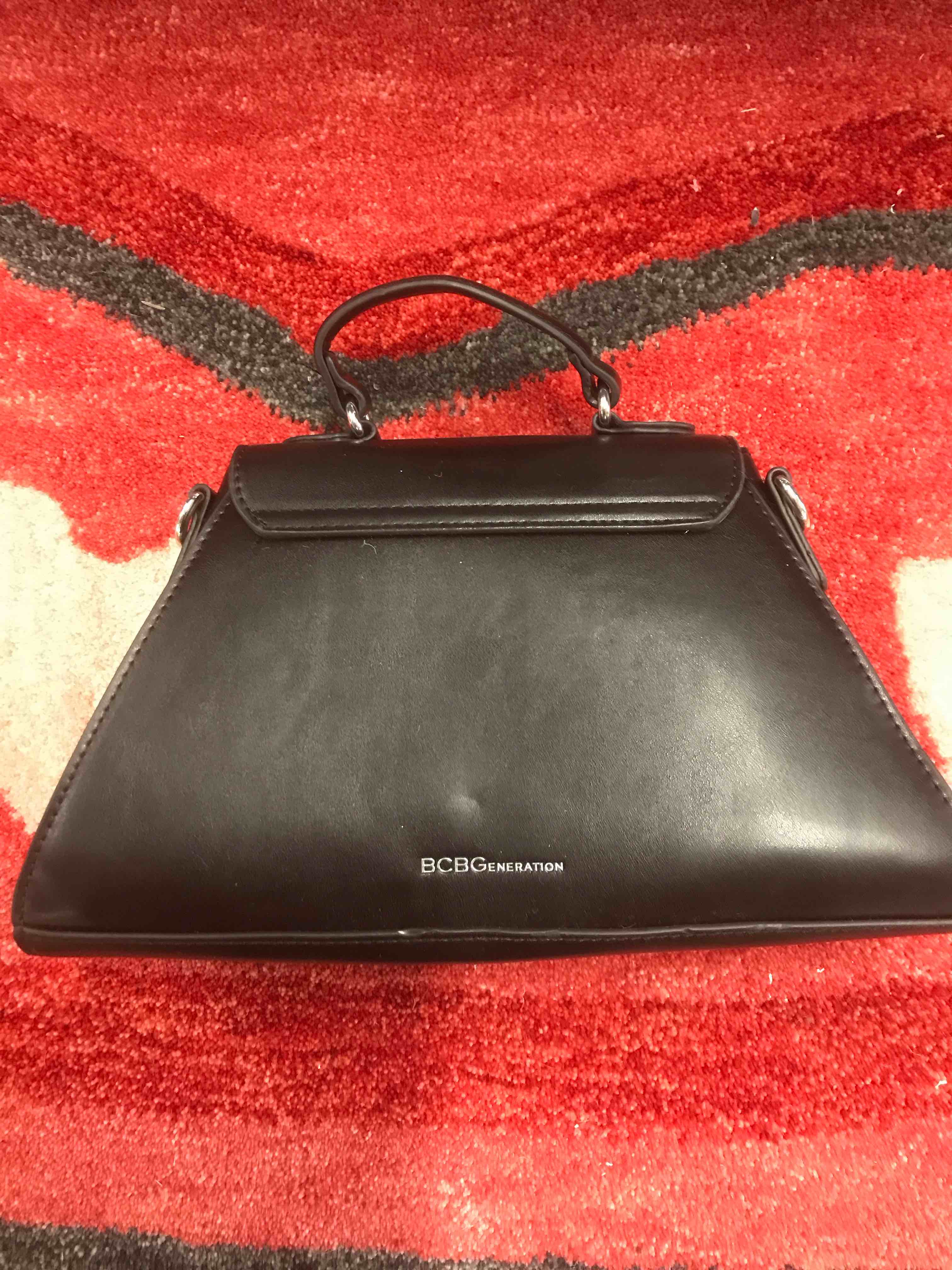 Condition photo showing As Is for BCBG bag