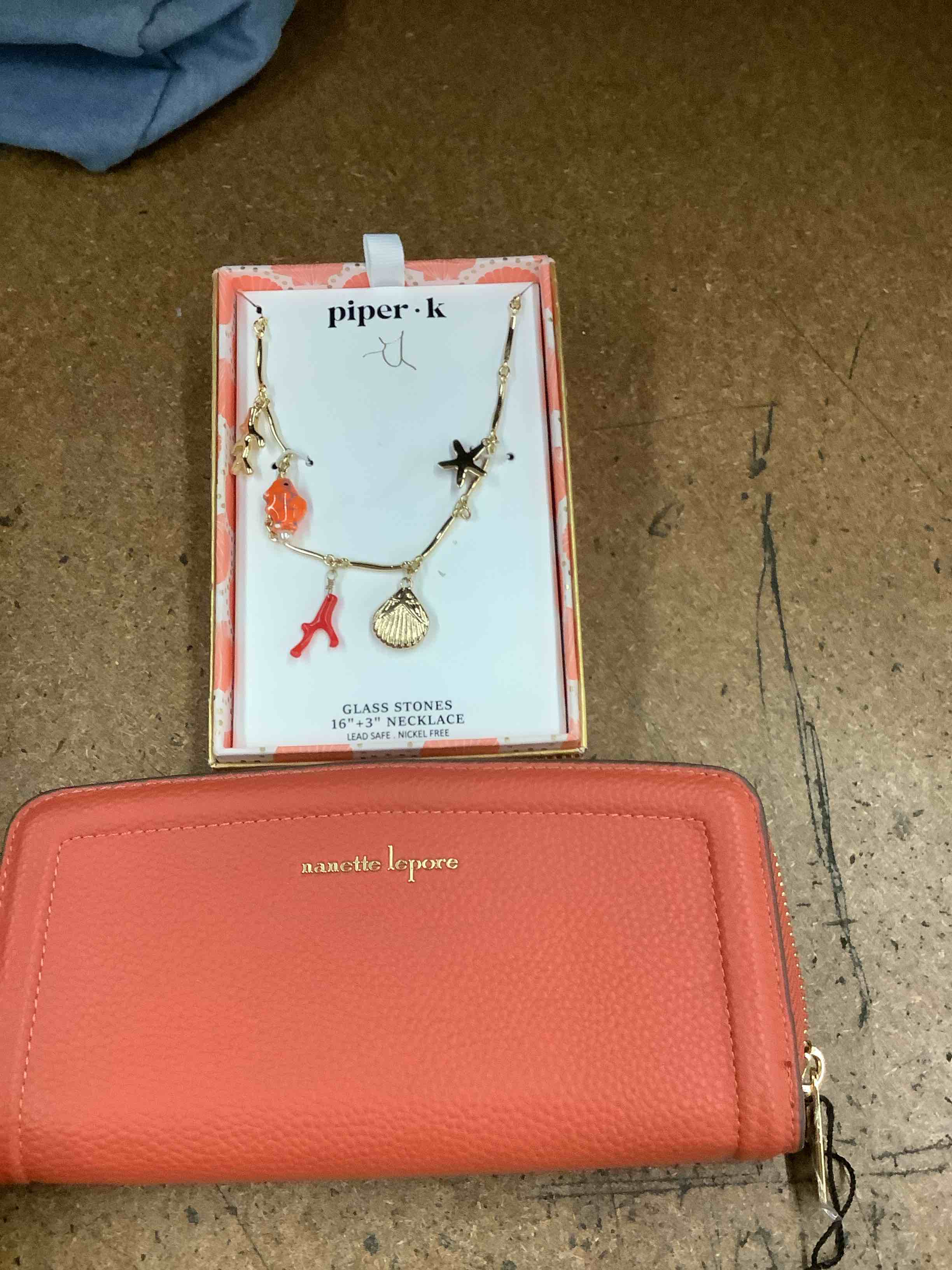 nanette Lenore orange wallet with piper k glass stone necklace 