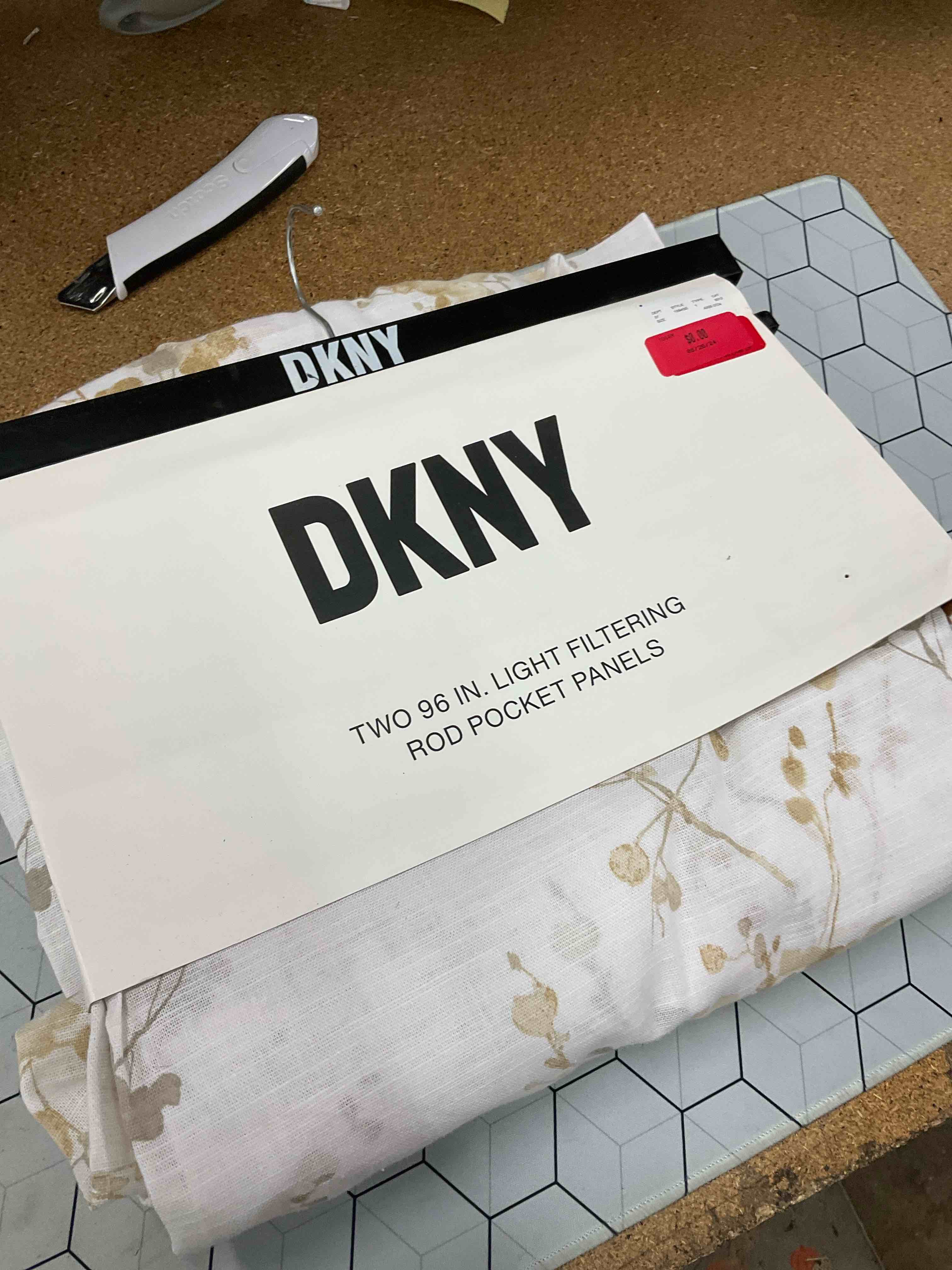 two 96 in light filtering rod pocket panels 