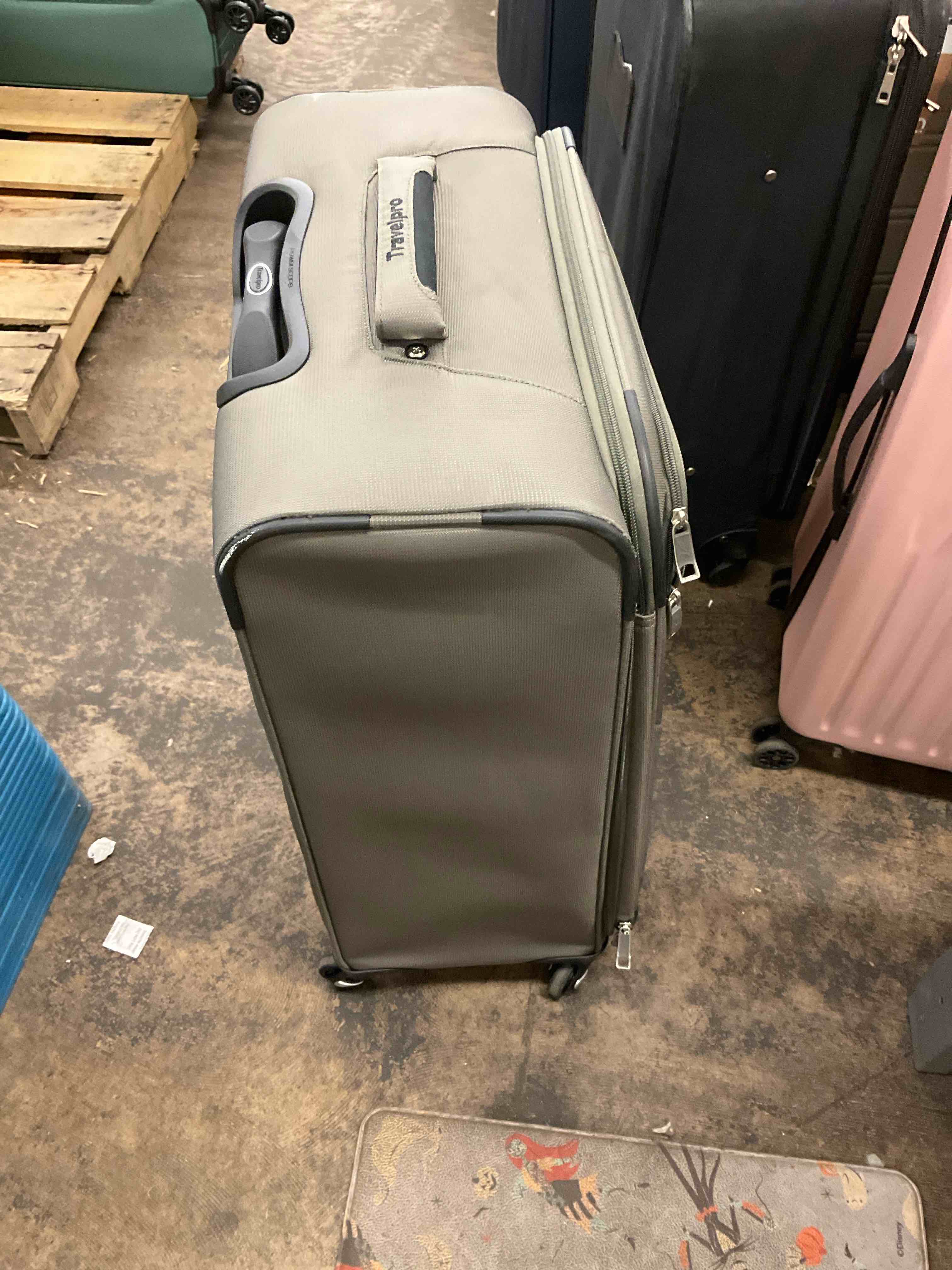 Condition photo showing As Is for suitcase 