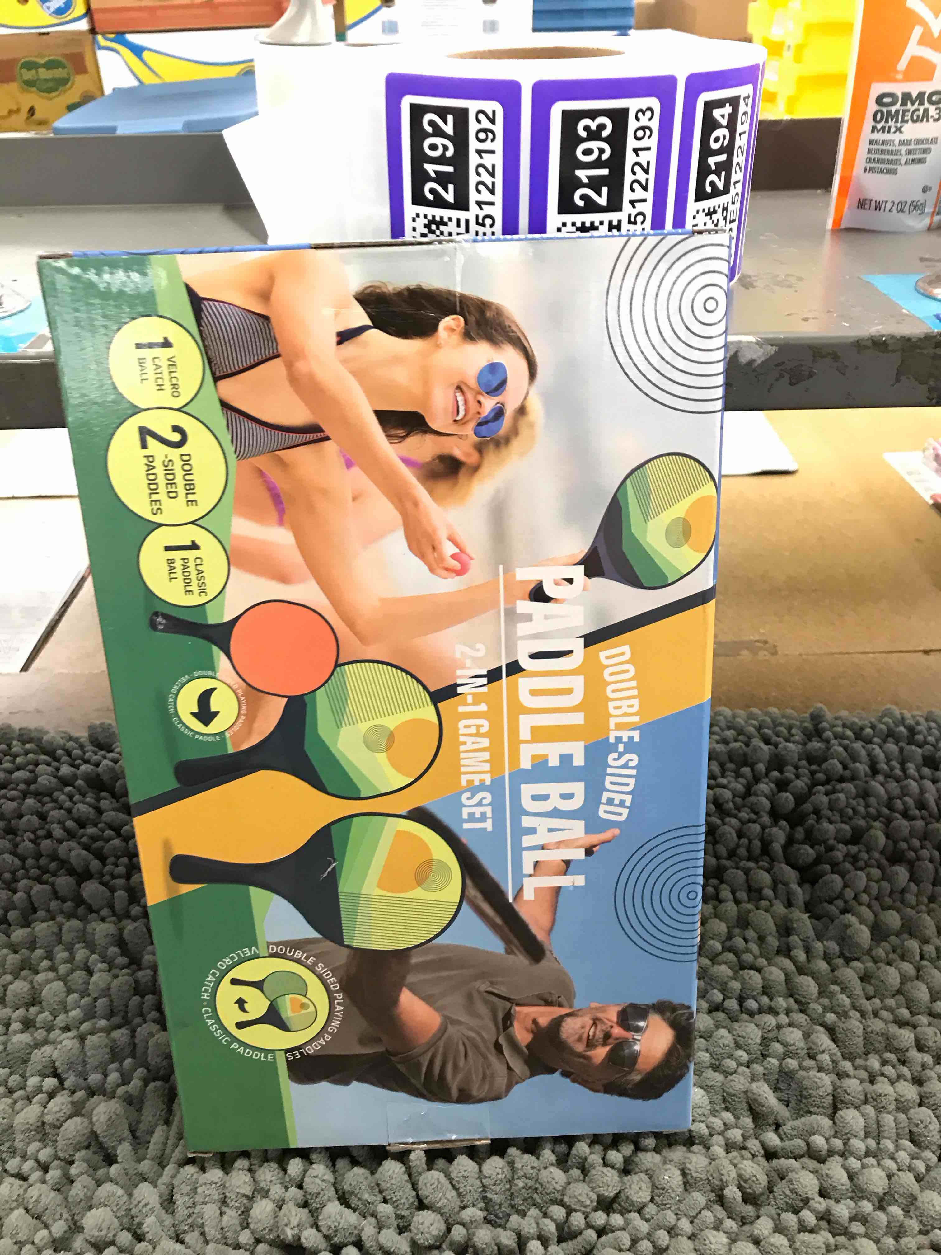 Condition photo showing New/Like New for double-sided paddle ball game set