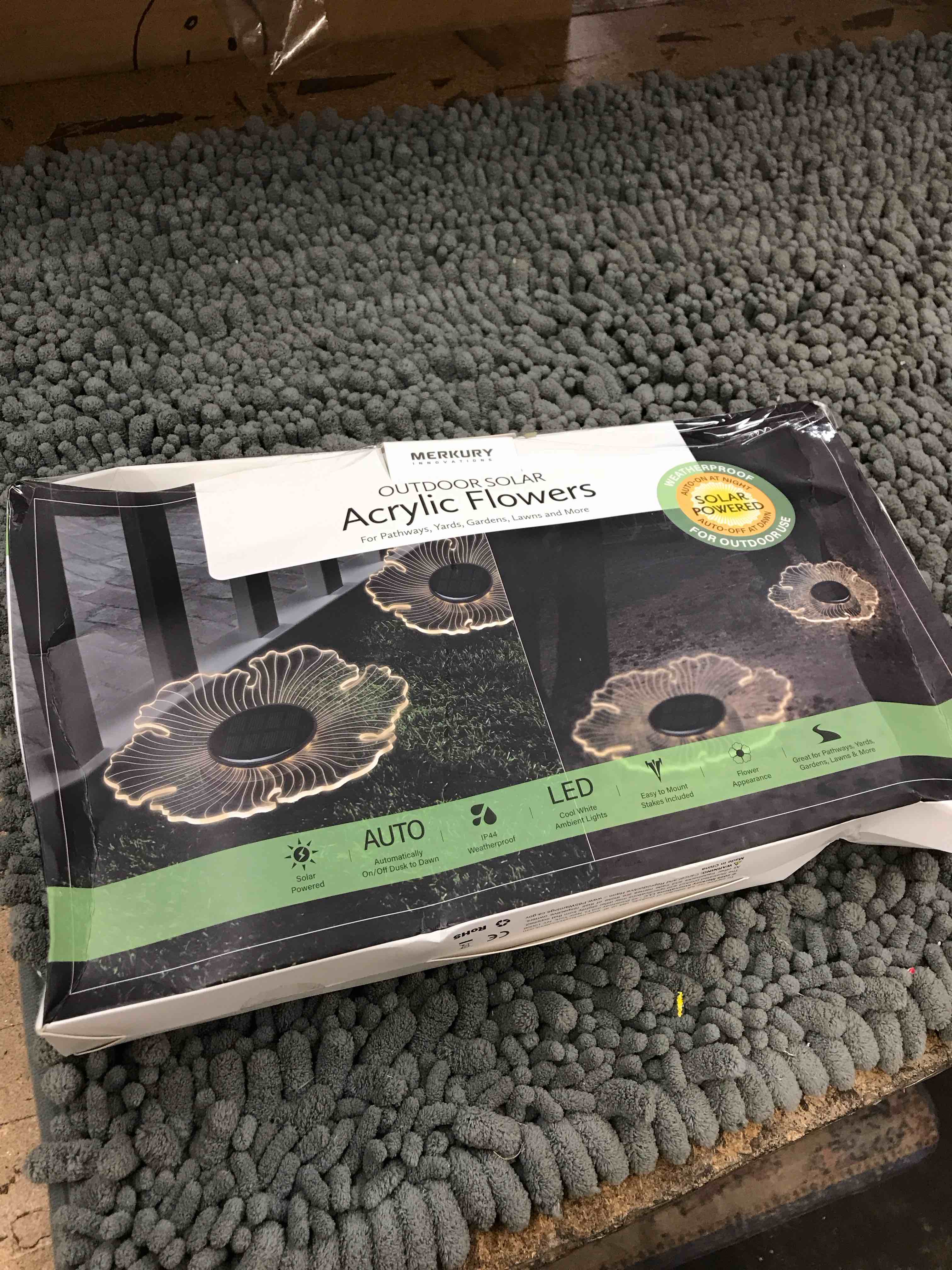 Condition photo showing New/Like New for outdoor solar acrylic flowers