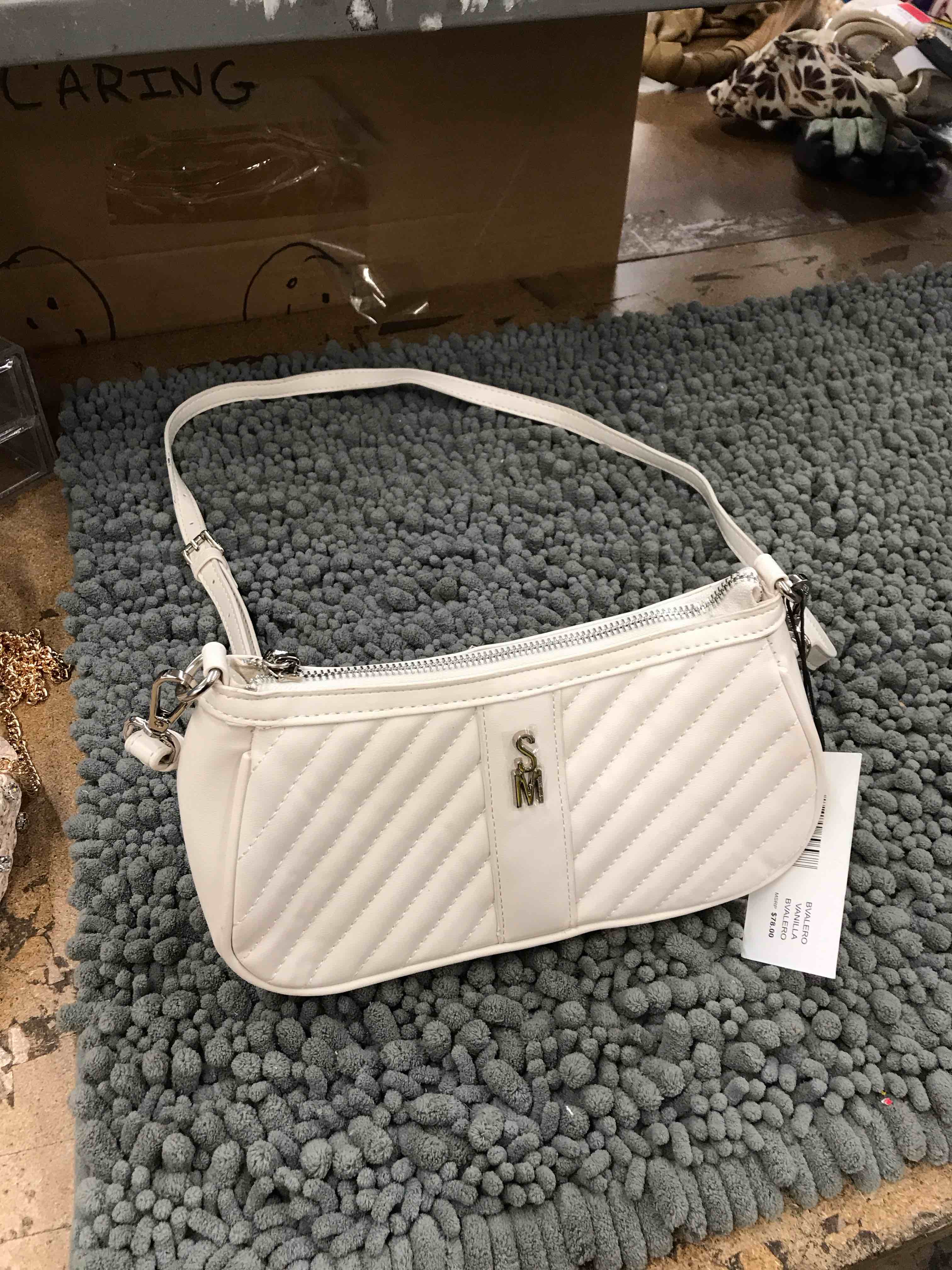 Condition photo showing New/Like New for steve madden purse
