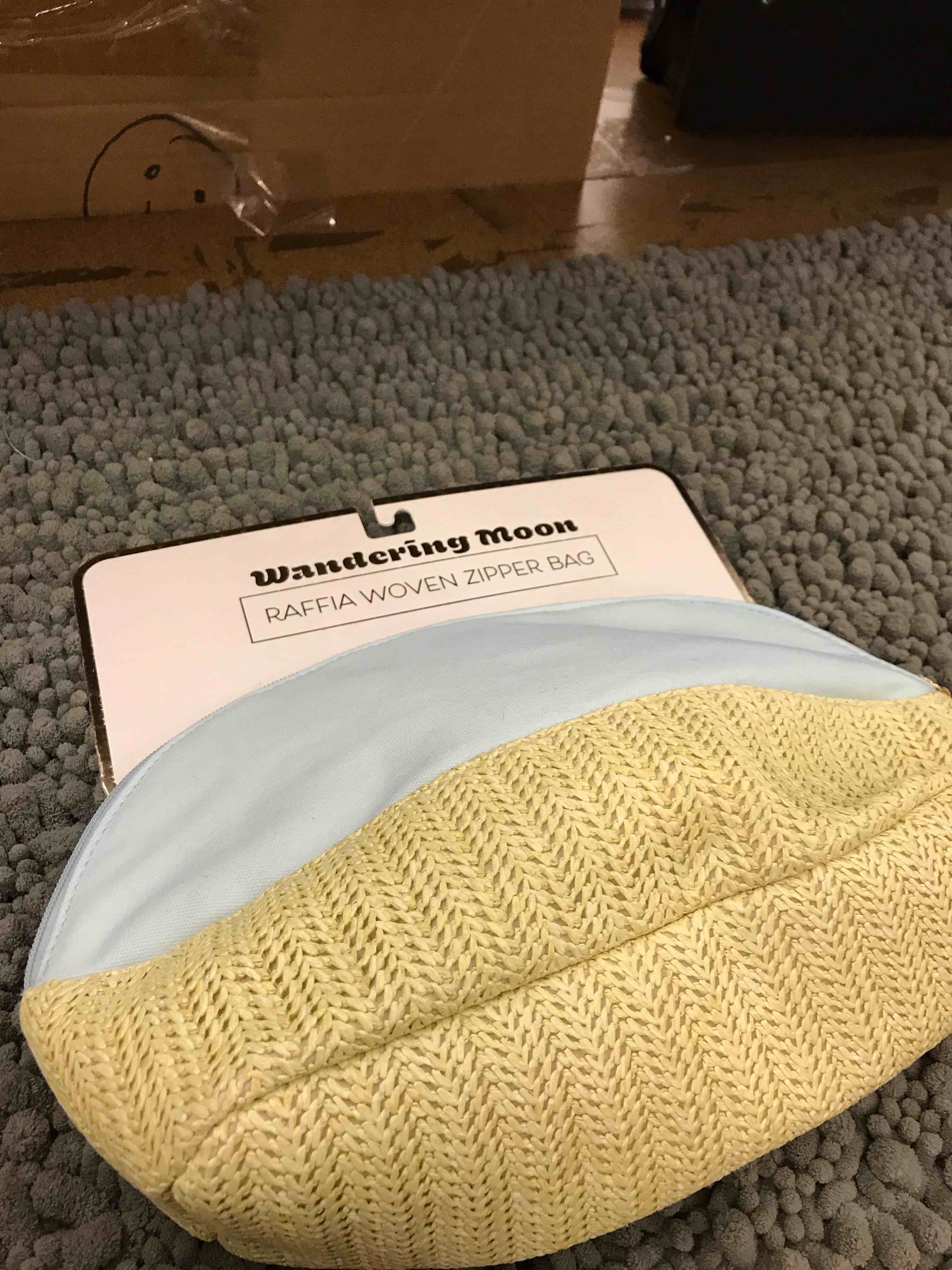 Condition photo showing New/Like New for raffia woven zipper bag