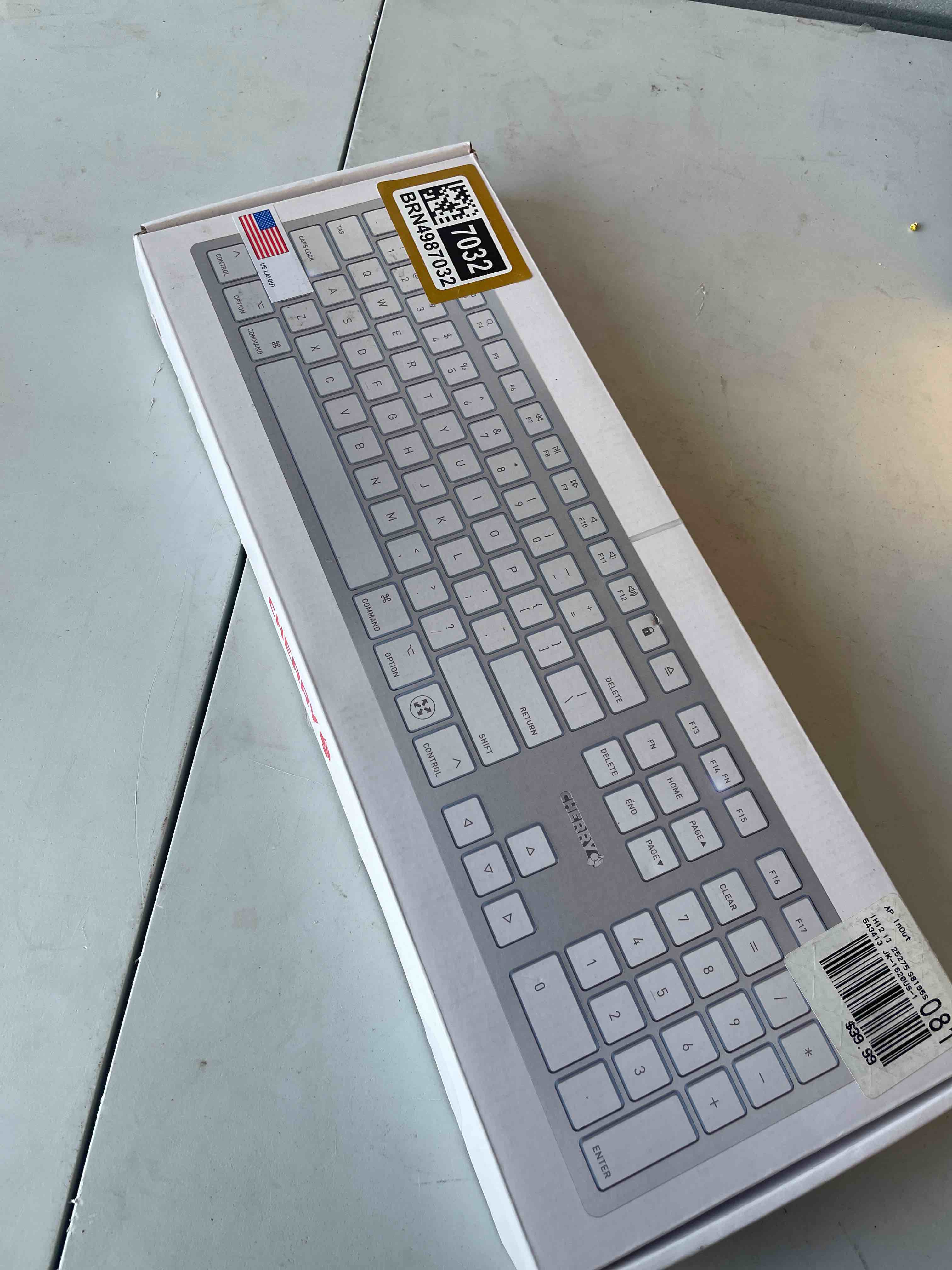 Condition photo showing As Is for cherry kc 6000 c slim keyboard made with mac layout. scissor tech typing for near silent. alternative to magic keyboards. usb-c wired. us layout white and silver.