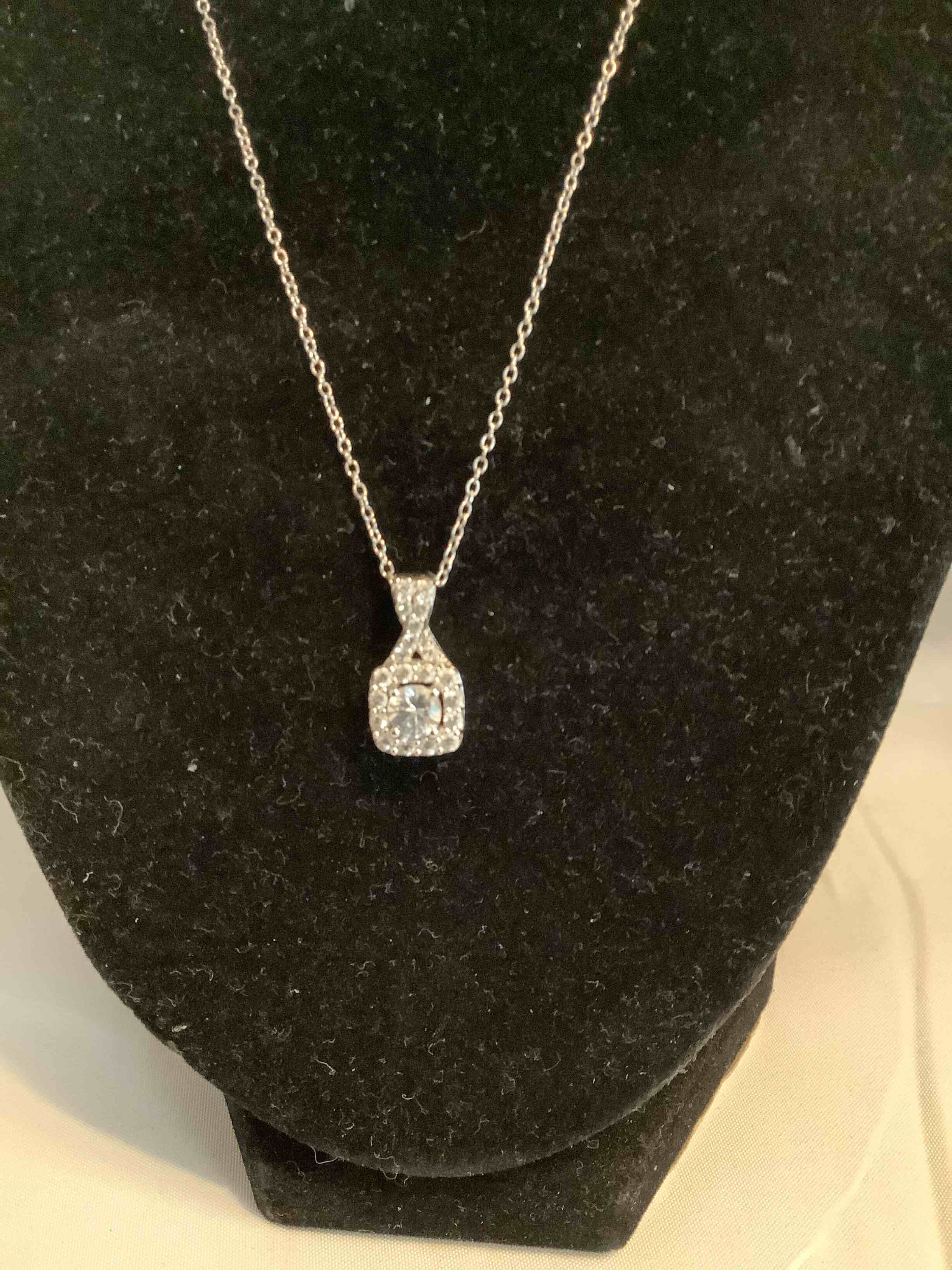 Condition photo showing New/Like New for white topaz earrigs