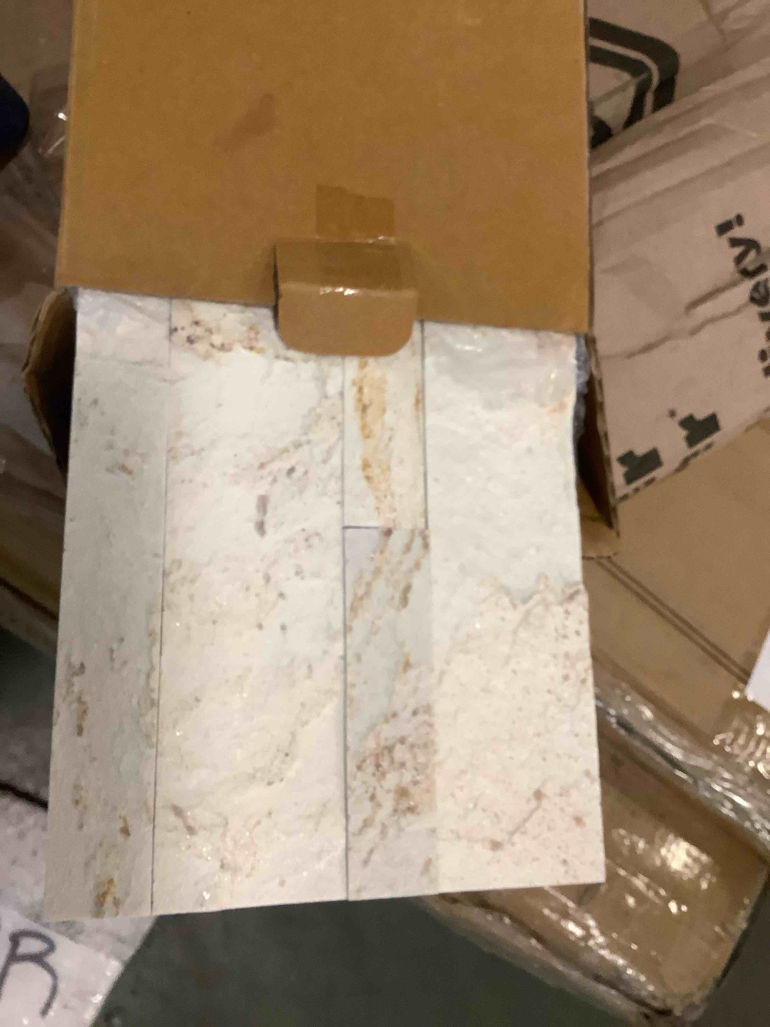 Condition photo showing Good Condition for 6" x 24" natural stone peel & stick mosaic tile