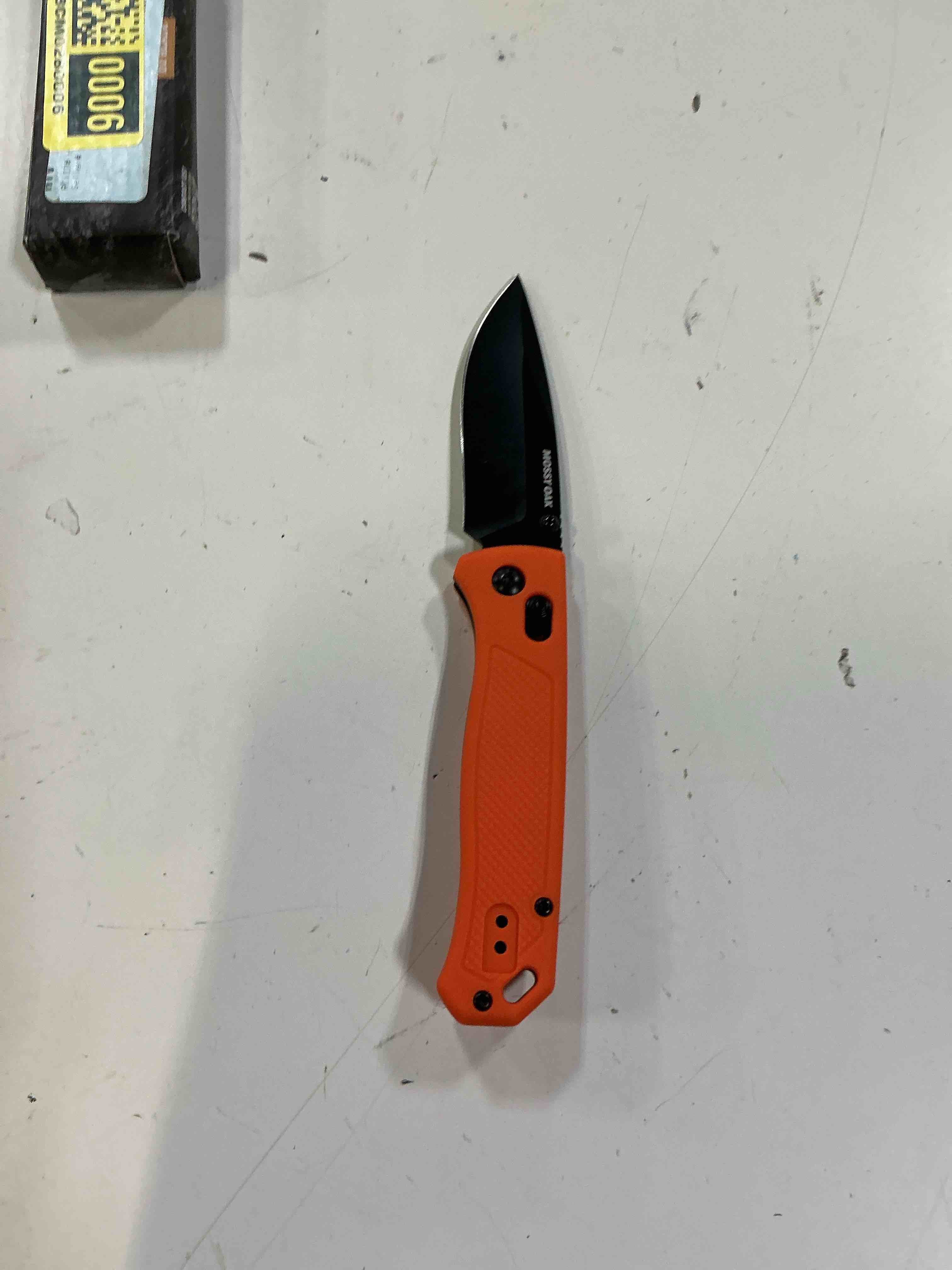 Condition photo showing New/Like New for mossy oak folding pocket knife, 3" d2 steel blade, crossbar lock