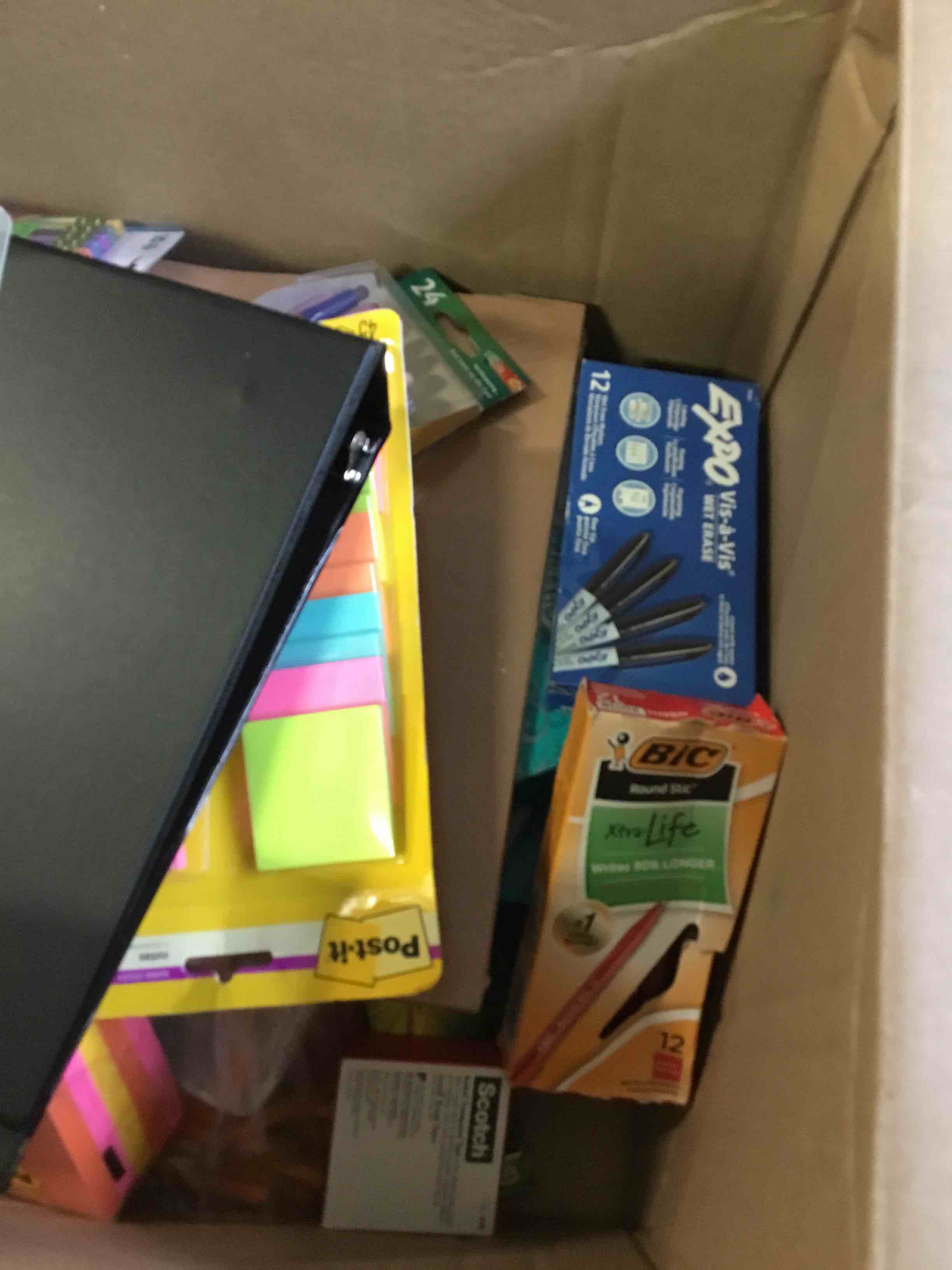 assorted office and school supplies pens pencils paper tissue sharpies construction paper eraser’s tape binder’s 