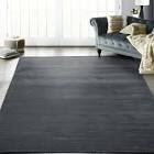 thin dark grey rug