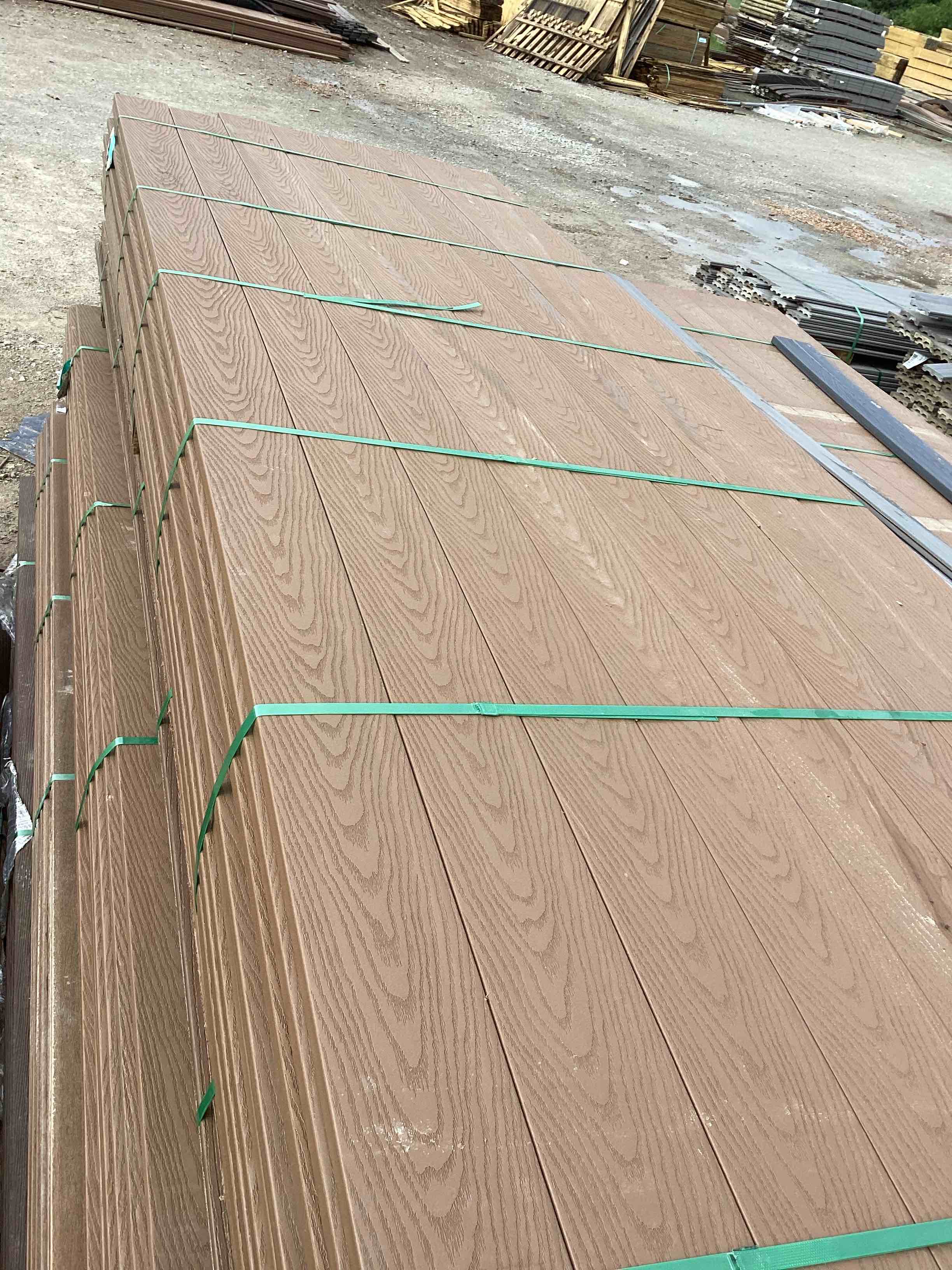 1,056 linear foot 88 pieces 12’ brown grooved composite decking your bid per linear foot 