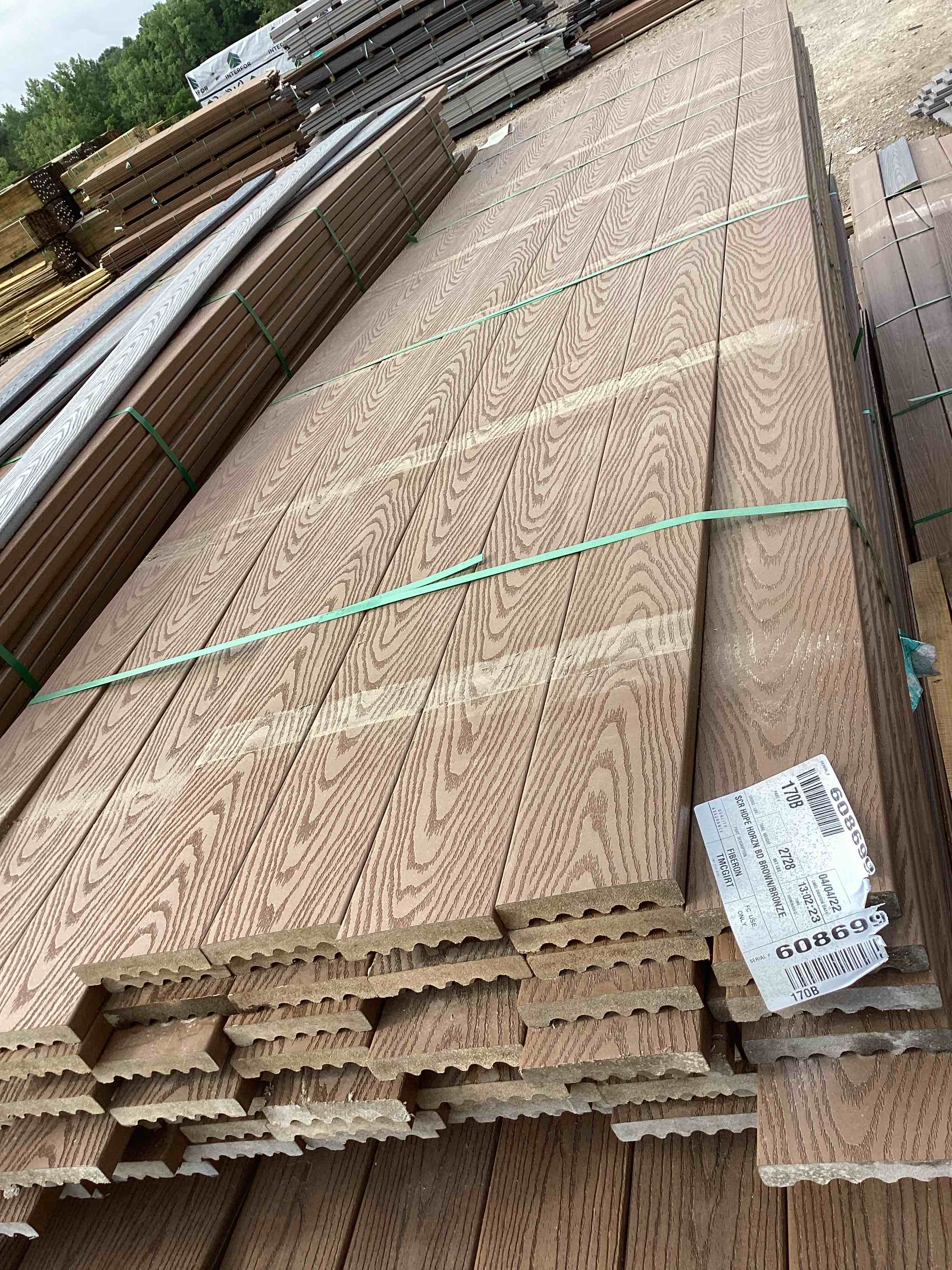 1,056 linear foot 88 pieces 12’ brown grooved composite decking your bid per linear foot 