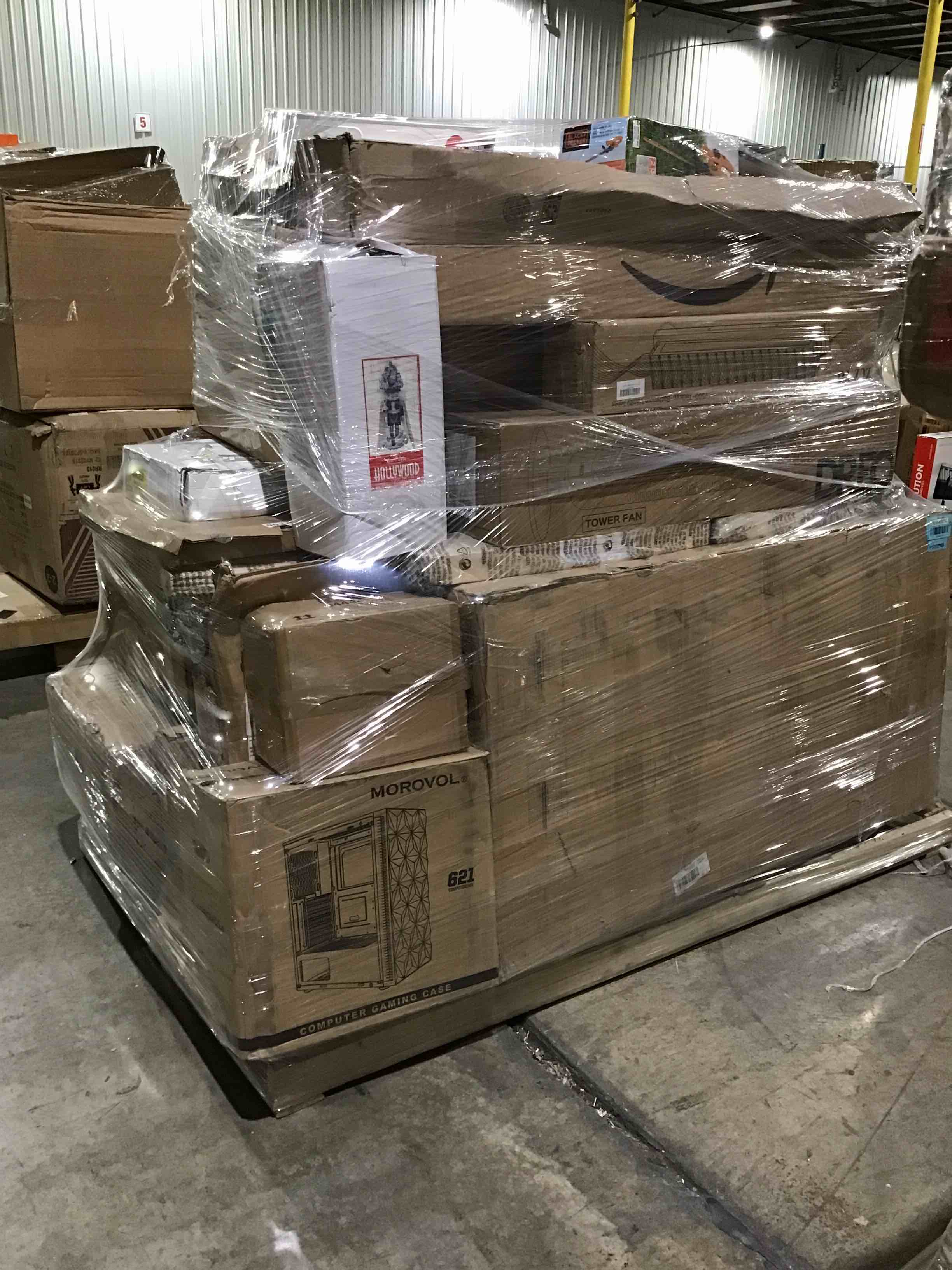 Pallet lot of assorted items- includes furniture, decor and more 