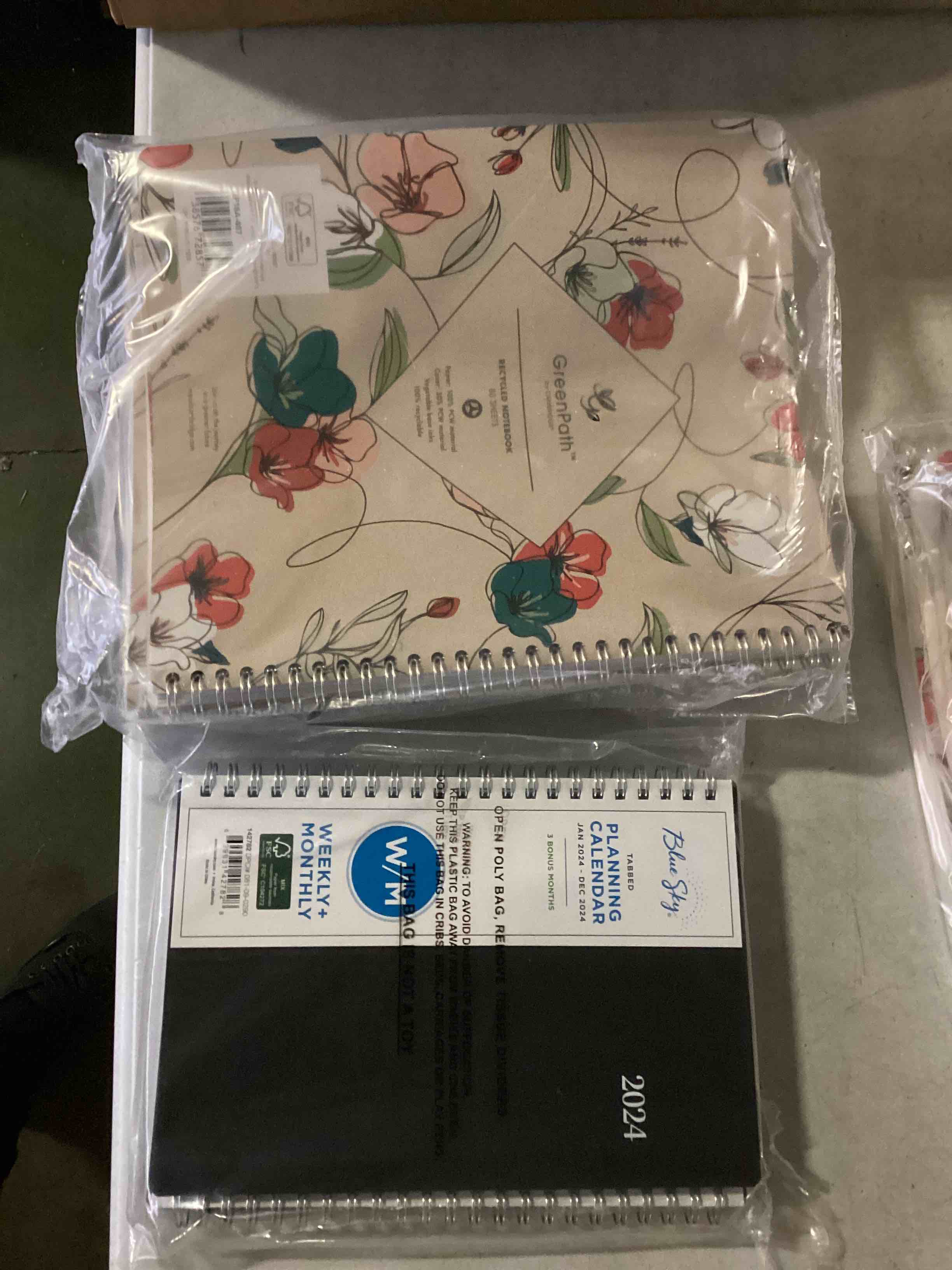 assorted office supplies including notebooks,planners and more. 