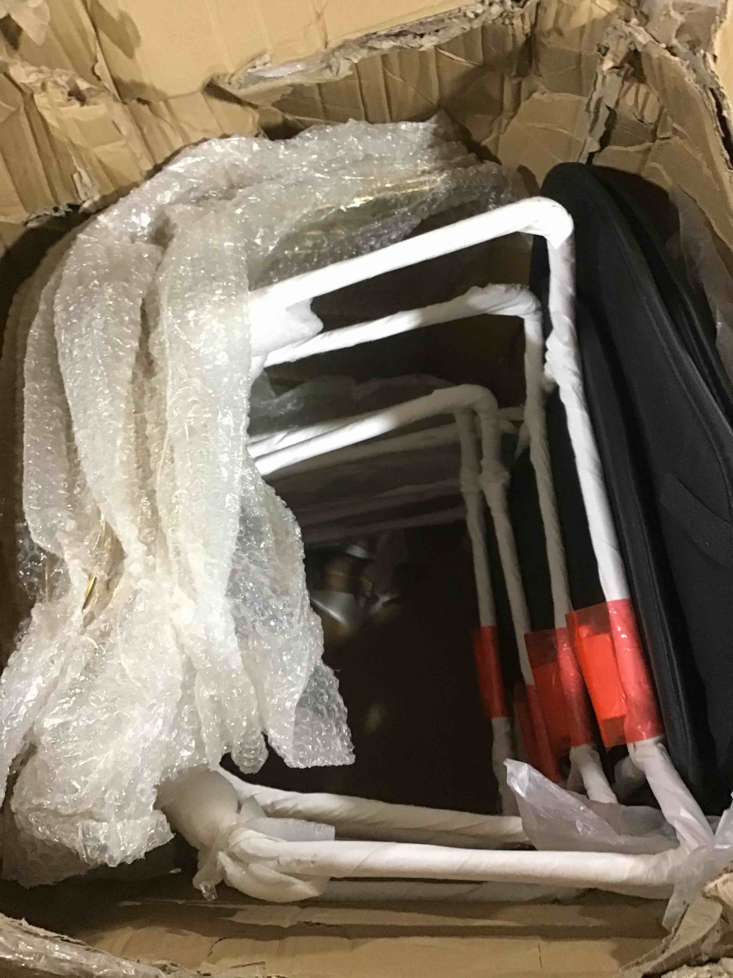 set of 4 gold stools with black and white pads