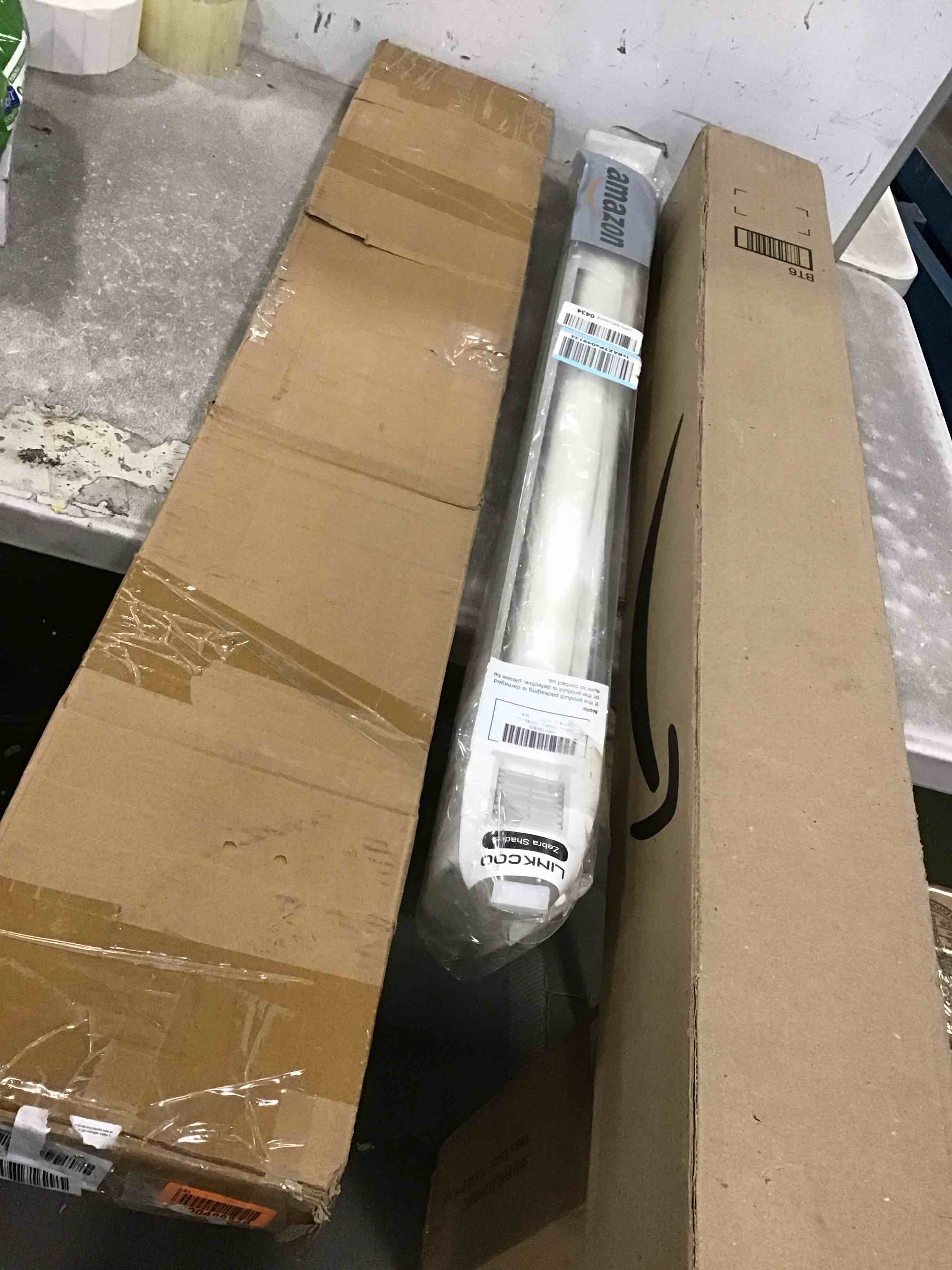 Assorted items including (Window Visors Sun Rain Guards, Roller shade window & curtain rod )