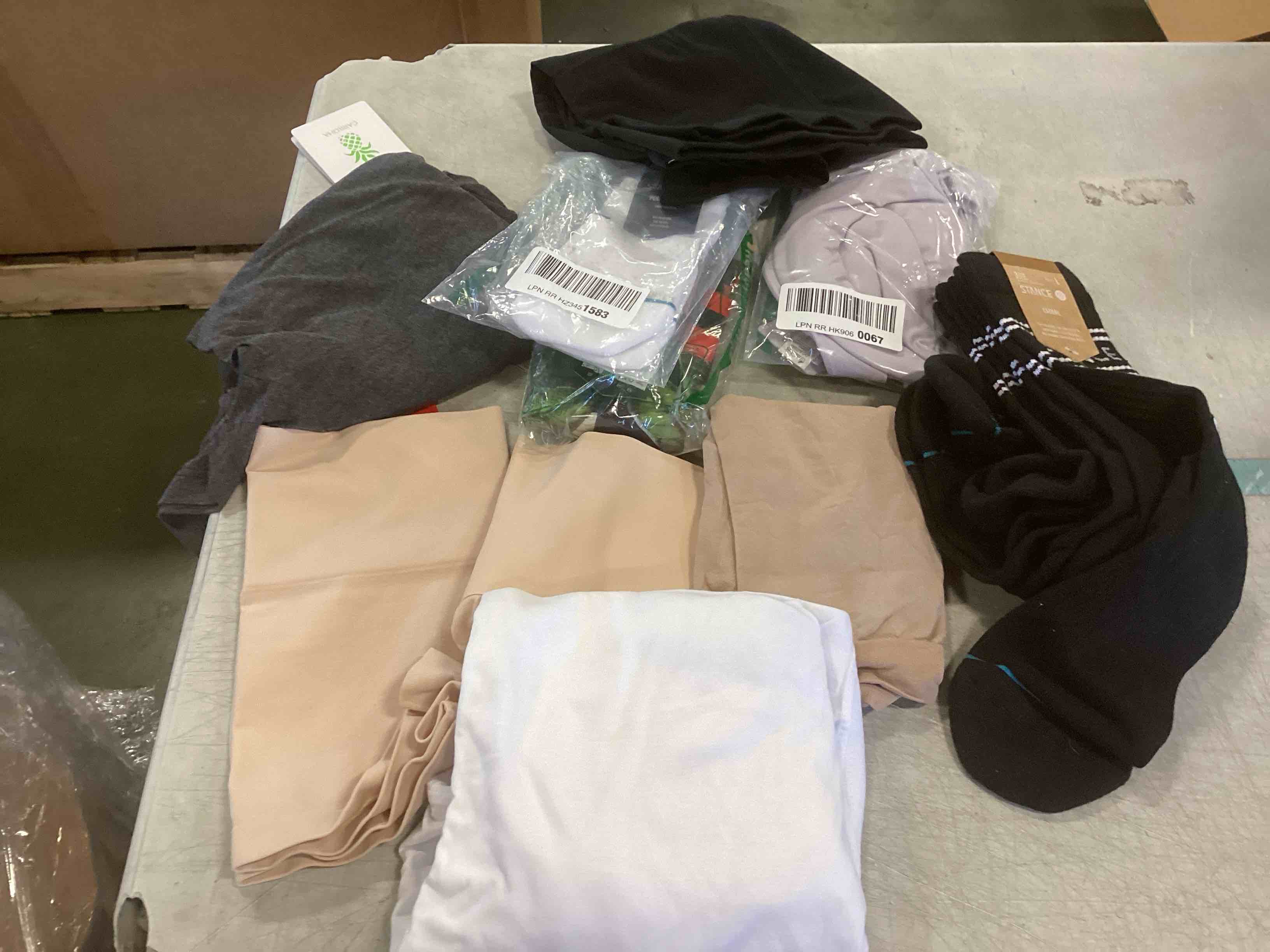 Assorted clothing for women and men includes, underwear, bra and socks((Styles and Sizes Vary))