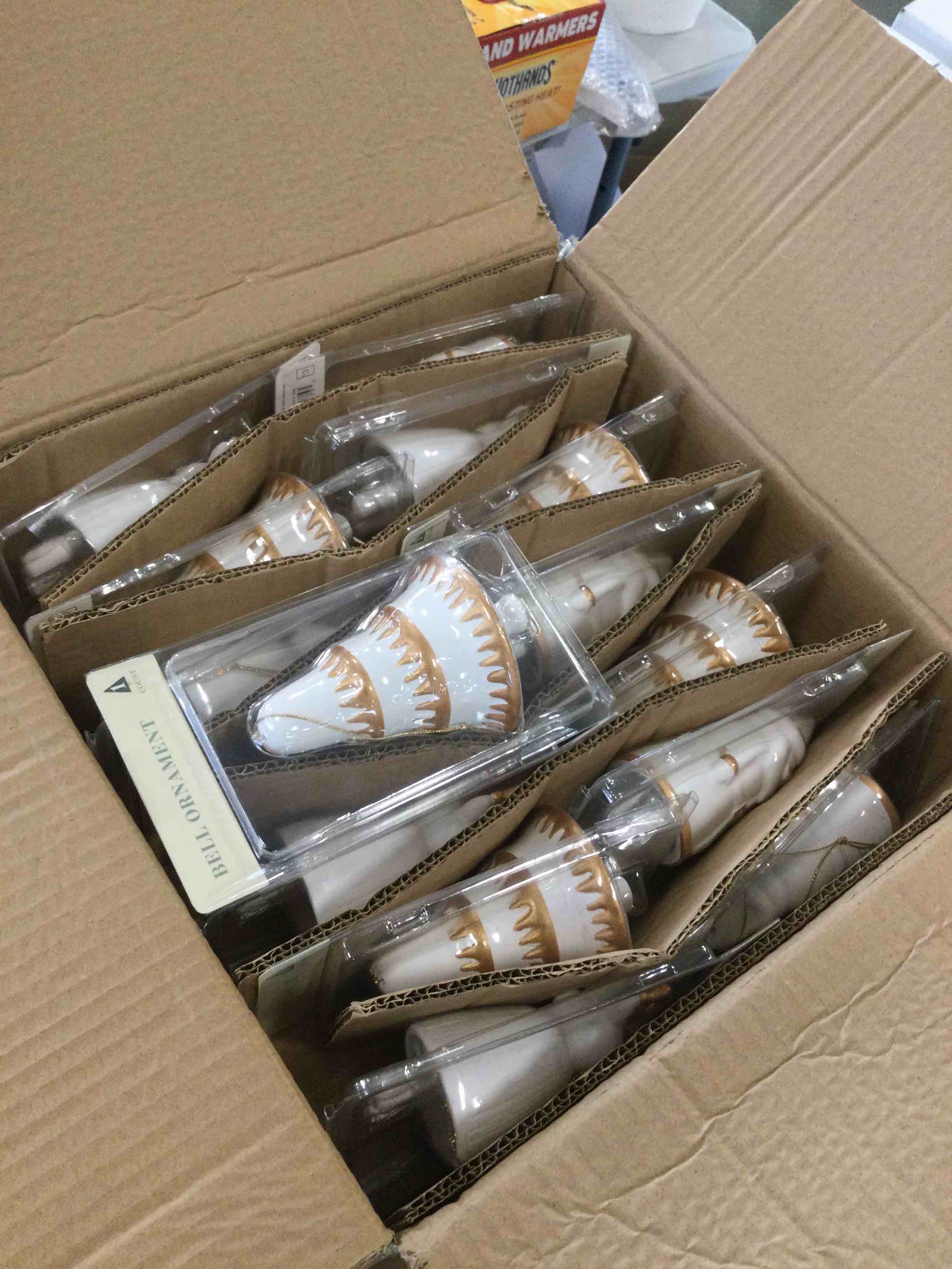 case of assorted Christmas bell ornaments 