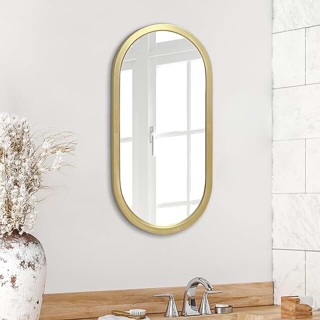 Oval, gold, framed wall mirror