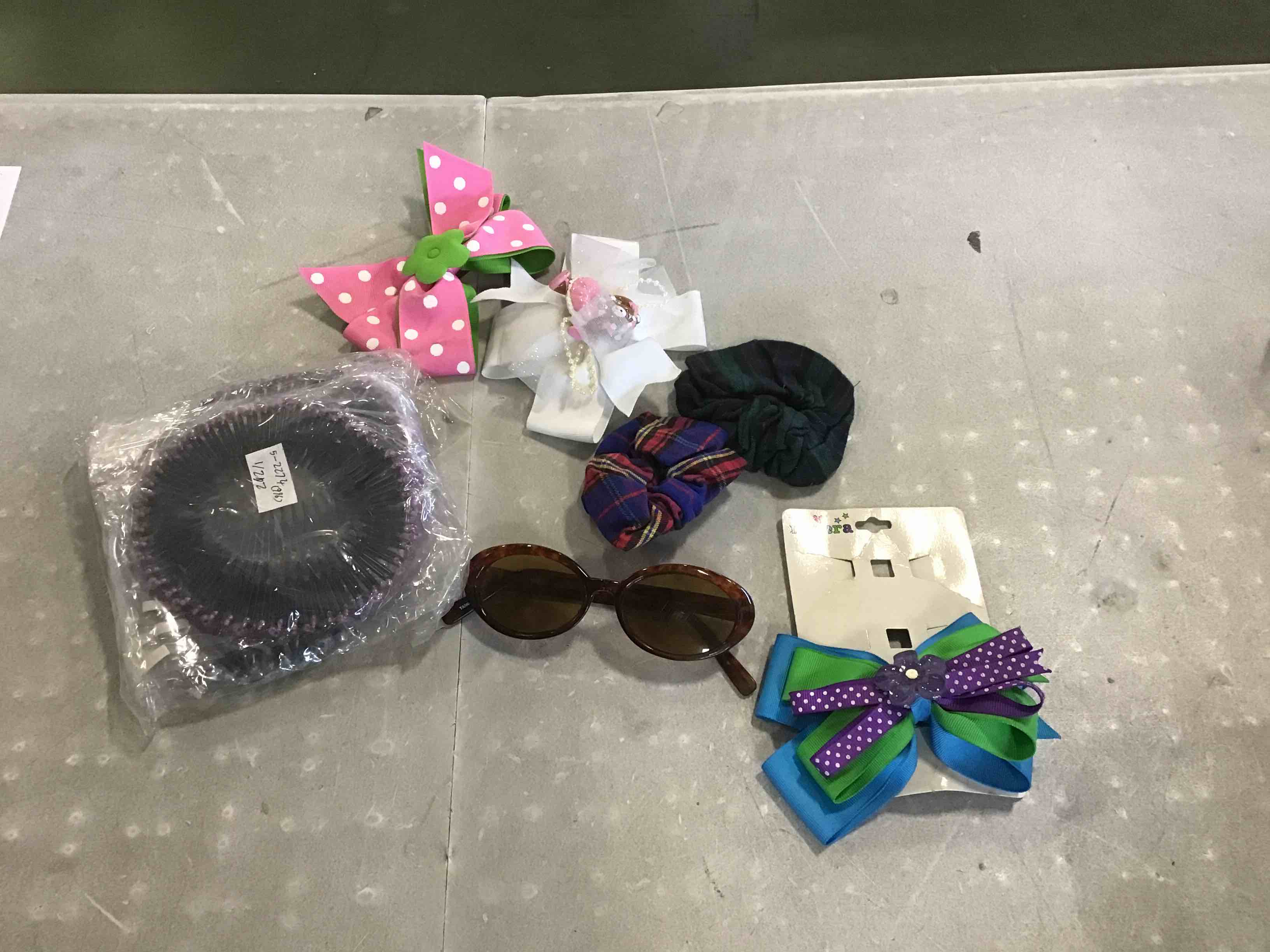 Box of assorted girls hair accessories and sunglasses, styles and sizes varies 