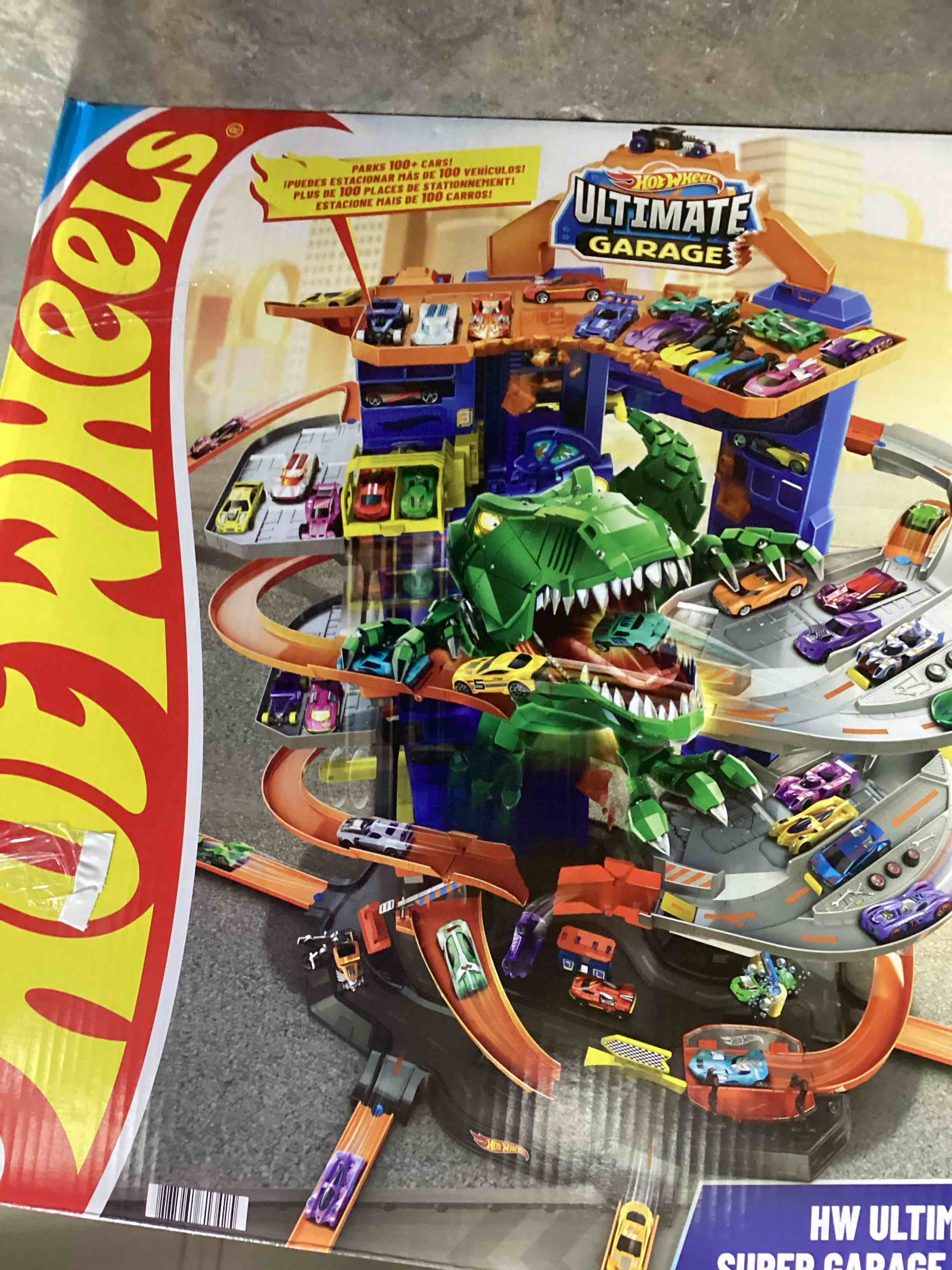 Condition photo showing New/Like New for Hot Wheels City Toy Car Track Set, Ultimate Garage with T-Rex Dinosaur, Store 100+ 1:64 Scale Vehicles, 3-ft Tall, with 2 Cars (Amazon Exclusive)