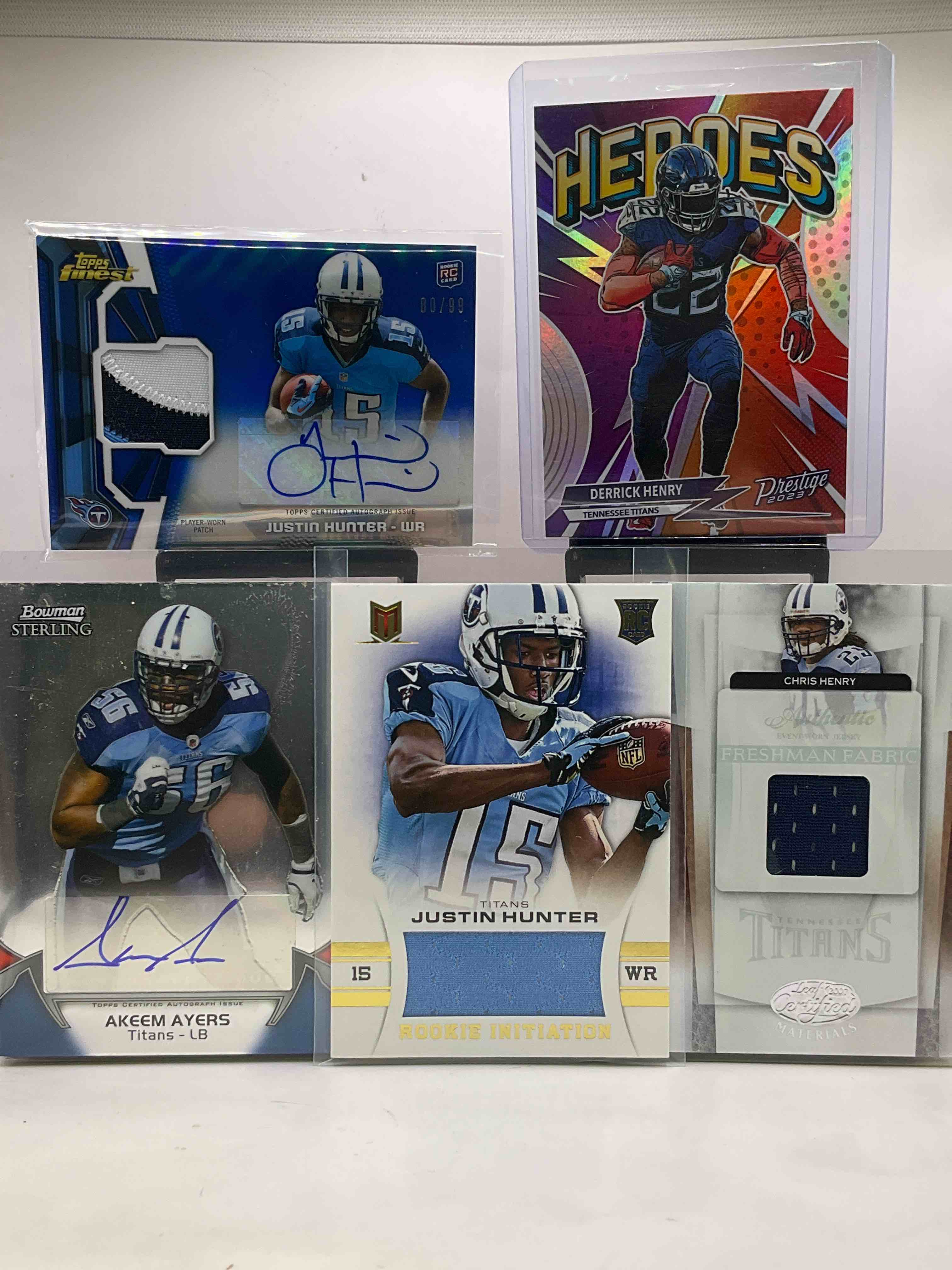 Titans! Signed! Numbered! Game-Worn Jersey & Rookie Cards! Derrick Henry Heroes Comic Card, Eddie George 39/45 2001 Card, Justin Hunter Signed Player Worn Jersey Card Numbered To /99, Akeem Myles Signed Card, Game Worn Justin Hunter Jersey Rookie Card, Chris Henry Jersey Card Worn By Henry At The 2007 Premier Day On May 17th, Along With Dozens Of Other Titans Players, All Time Greats & Even Some Vintage Cards! Even A Warren Moon!