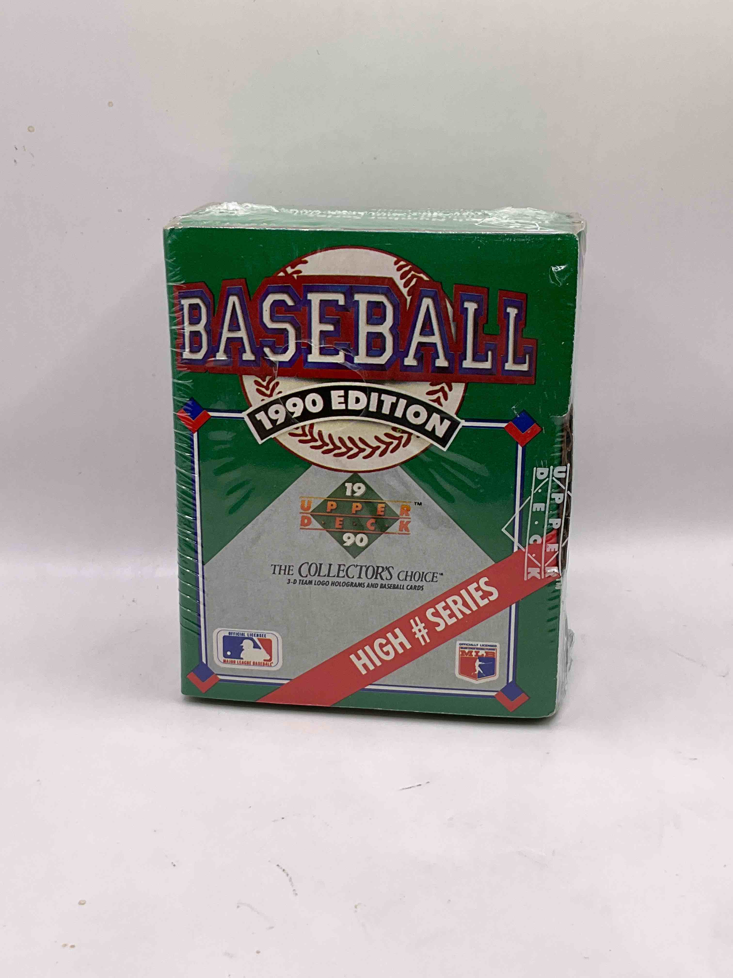 1990 High Series! First Ever Auto Insert, Possibility! 1990 Upper Deck Baseball HIGH SERIES Sealed Box! Box Includes Cards 701-800 & Contains The Newest Rookies & Traded Players From 1990. This Box Has Become Infamous For "Find The Reggie!" There Were 2500 Randomly Inserted Signed Reggie Jackson Hero Cards Placed In These Boxes, The First Time Random Auto Cards Were Packed In Hobby Boxes (A Common Practice Today). Search For The Possibility Of A Reggie Signed Auto Card (PSA 10 Value $750. A Great Piece Of Sports Memorabilia!