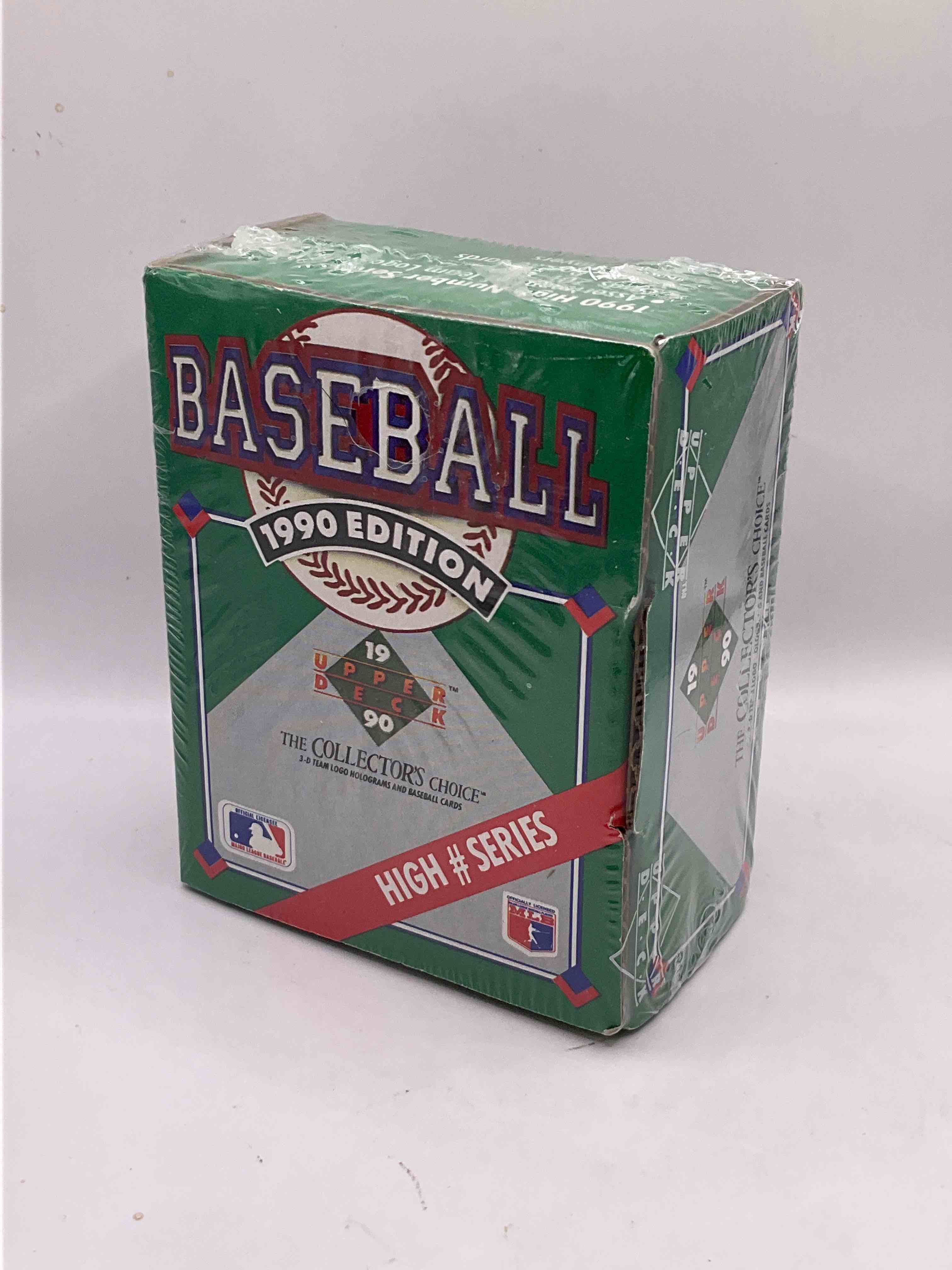 1990 High Series! First Ever Auto Insert, Possibility! 1990 Upper Deck Baseball HIGH SERIES Sealed Box! Box Includes Cards 701-800 & Contains The Newest Rookies & Traded Players From 1990. This Box Has Become Infamous For "Find The Reggie!" There Were 2500 Randomly Inserted Signed Reggie Jackson Hero Cards Placed In These Boxes, The First Time Random Auto Cards Were Packed In Hobby Boxes (A Common Practice Today). Search For The Possibility Of A Reggie Signed Auto Card (PSA 10 Value $750. A Great Piece Of Sports Memorabilia!