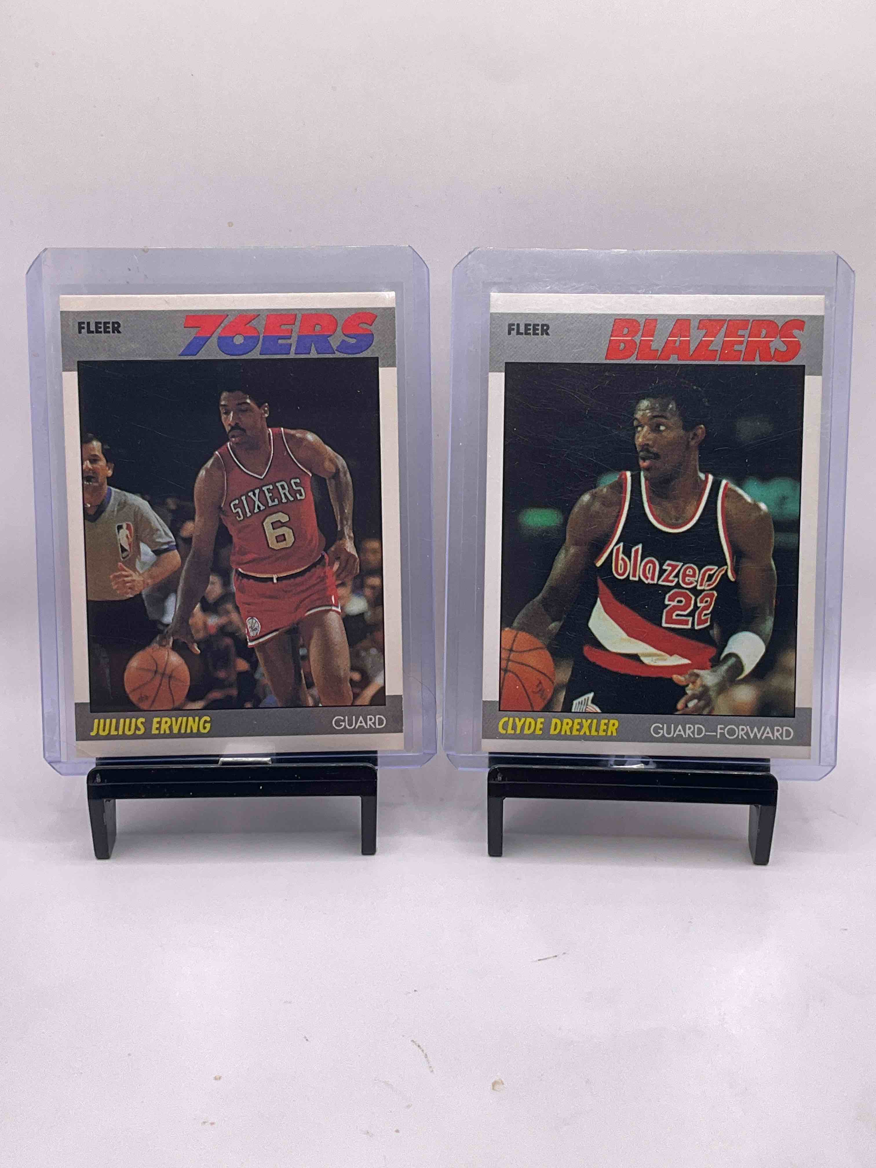 1987 Fleer NBA, WHAT?! Your Chance To Get Some Of The Rarest Basketball Cards Anywhere, 1987 Fleer NBA! Six Great Players To Include "Dr. J" Julius Erving, "Clyde The Glide" Drexler, Karl Malone, Isiah Thomas, Darrel Griffith & Akeem Olajuwon! 1987 Fleer Basketball Is Truly Just About Iconic As It Gets & Is Nearly Impossible To Find! All Cards In Great Shape & In Protective Sleeves & Holders. Don't Miss Out On This One-Of-A-Kind Investment!