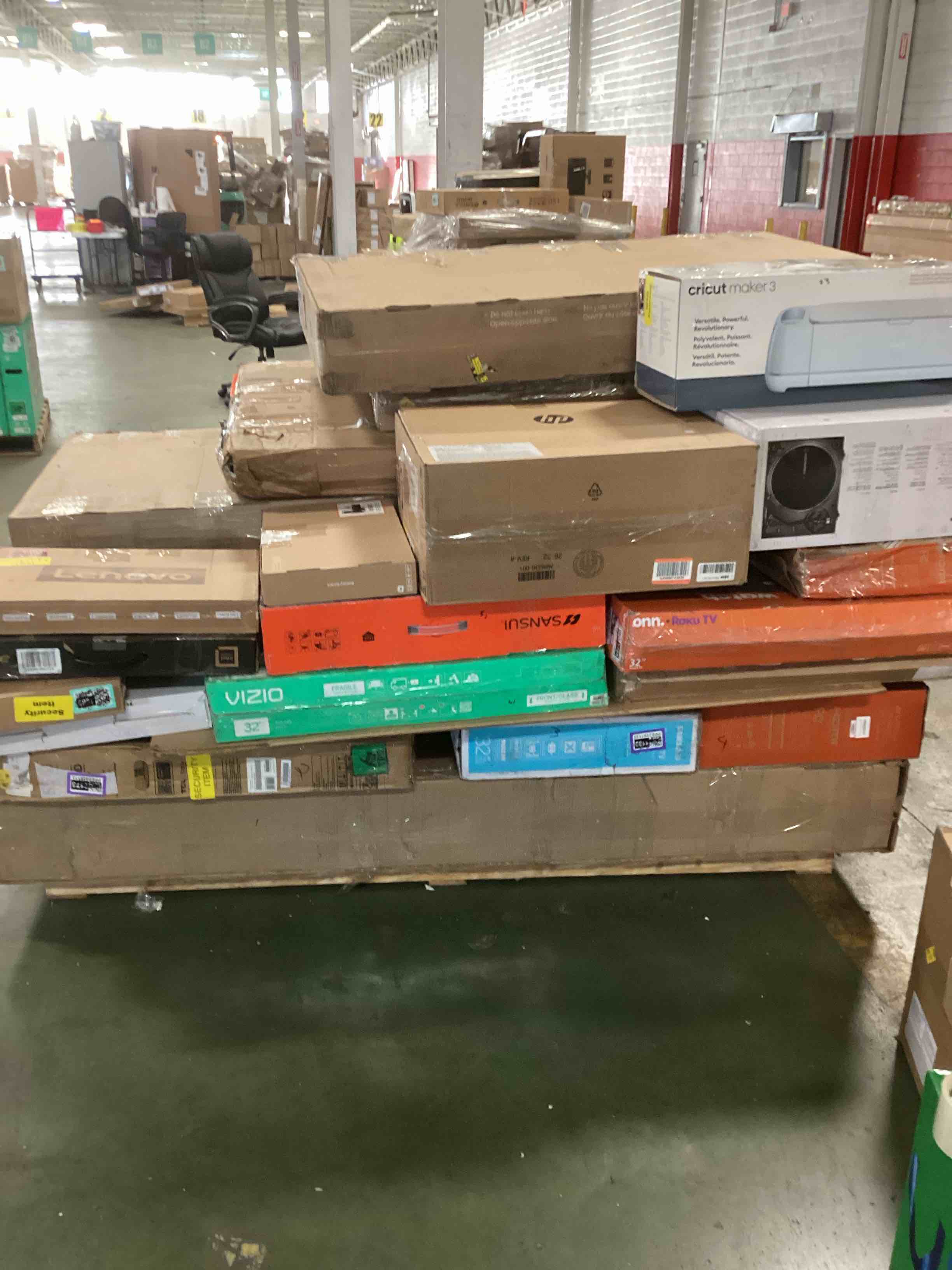 pallet of defective electronics for parts