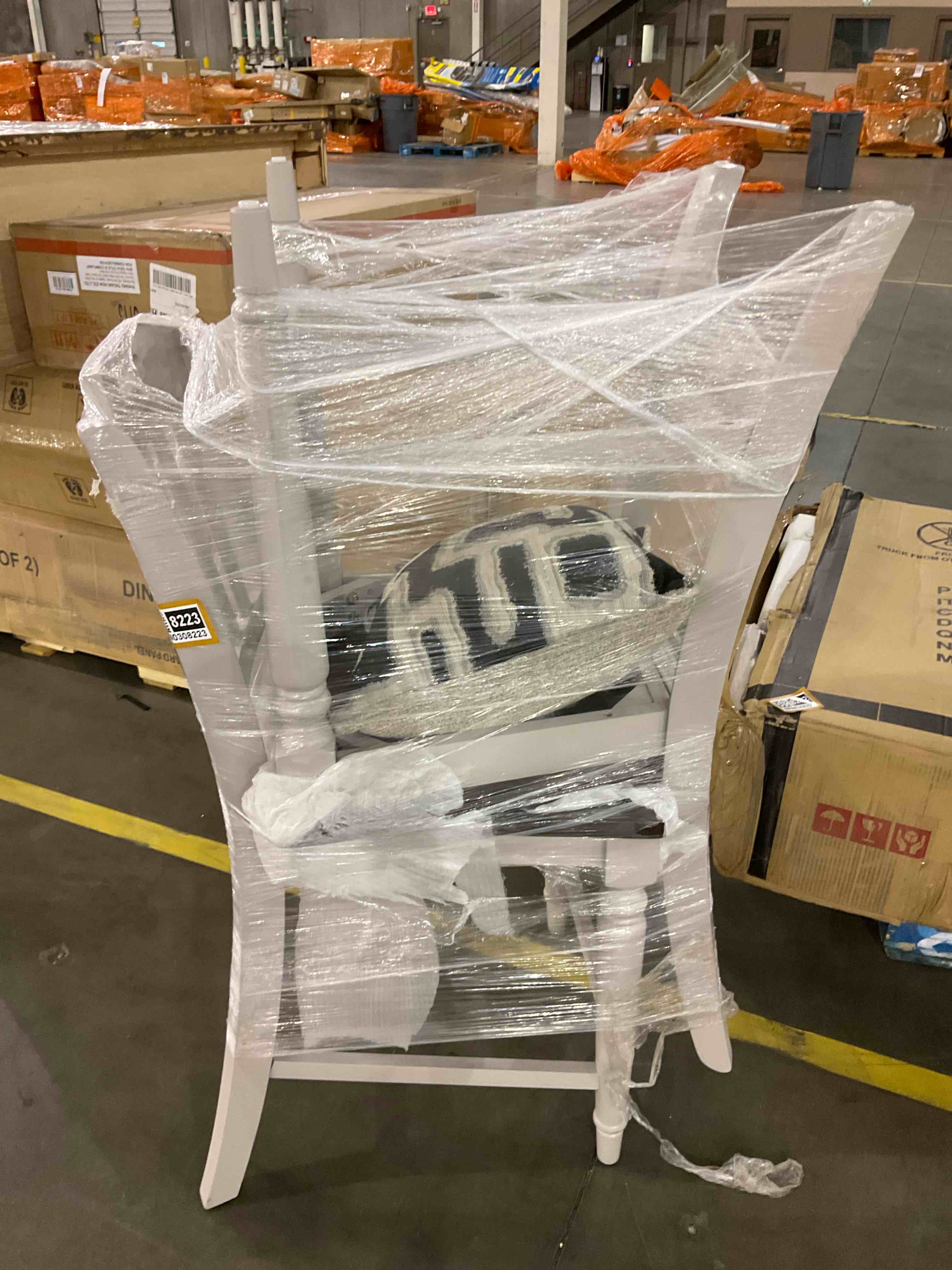 2 grey chairs and a pillow