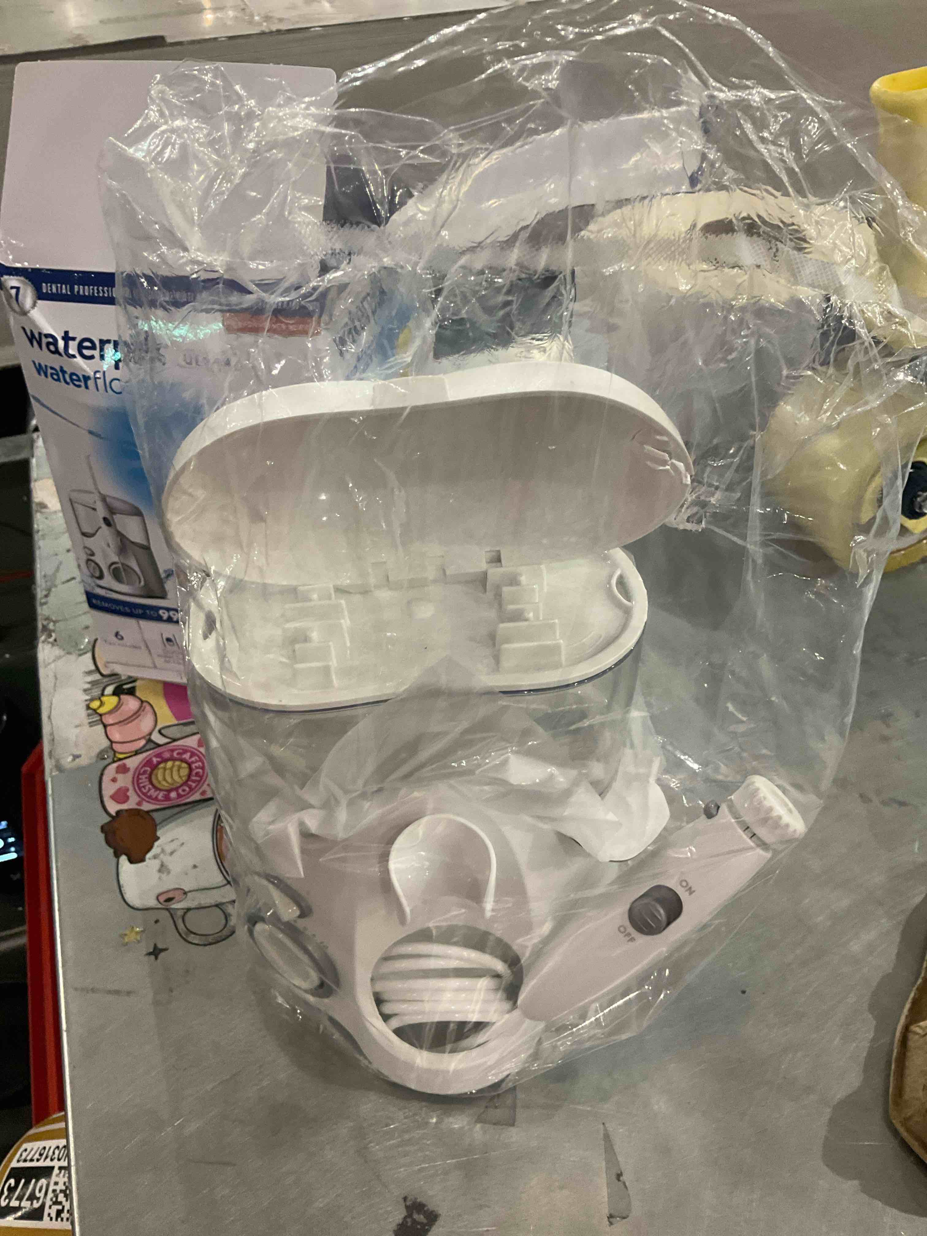 Condition photo showing As Is for Waterpik Ultra Water Flosser
