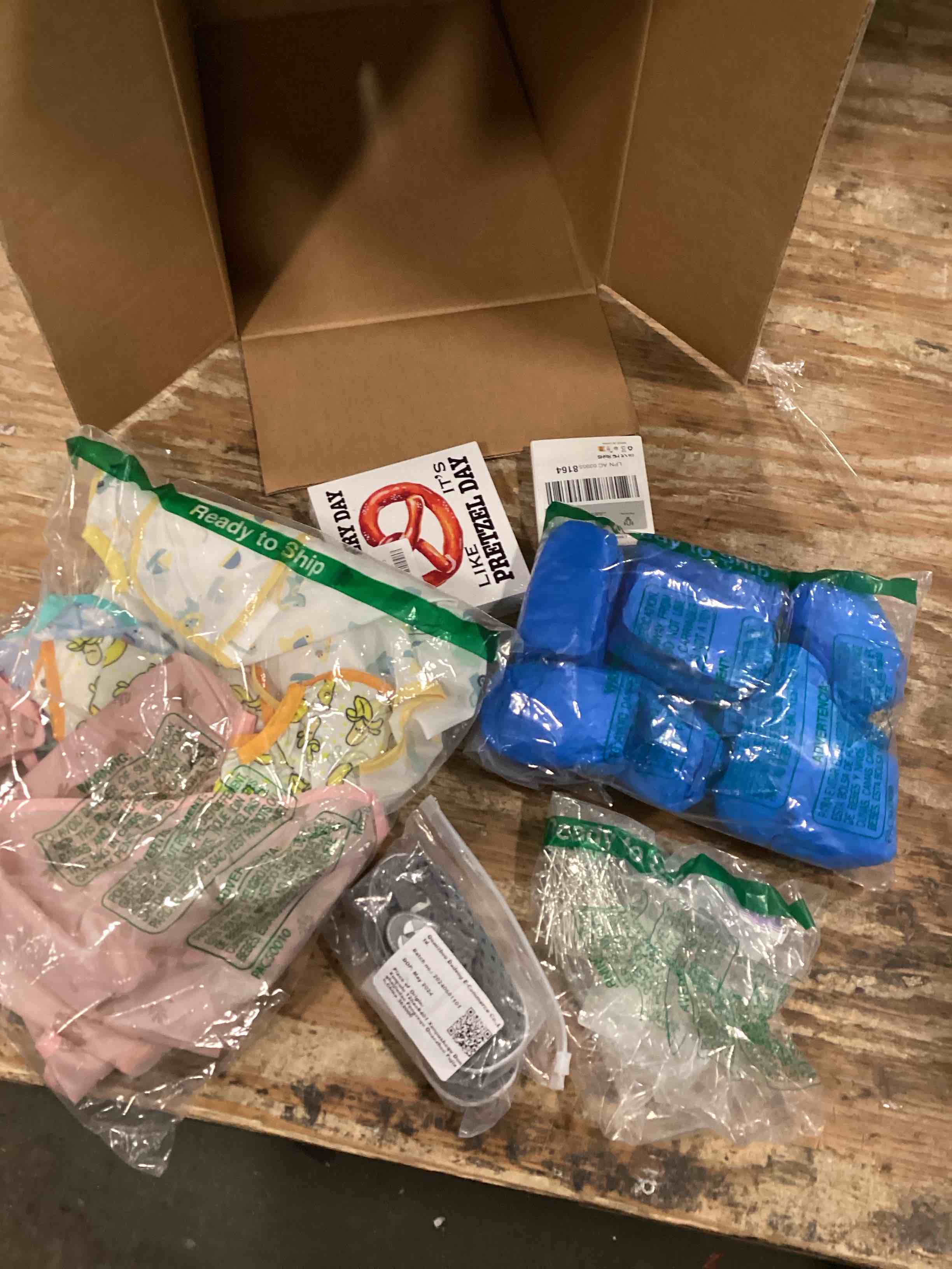 assorted miscellaneous items ( wooden sign, baby shoes, wireless lavalier microphone)