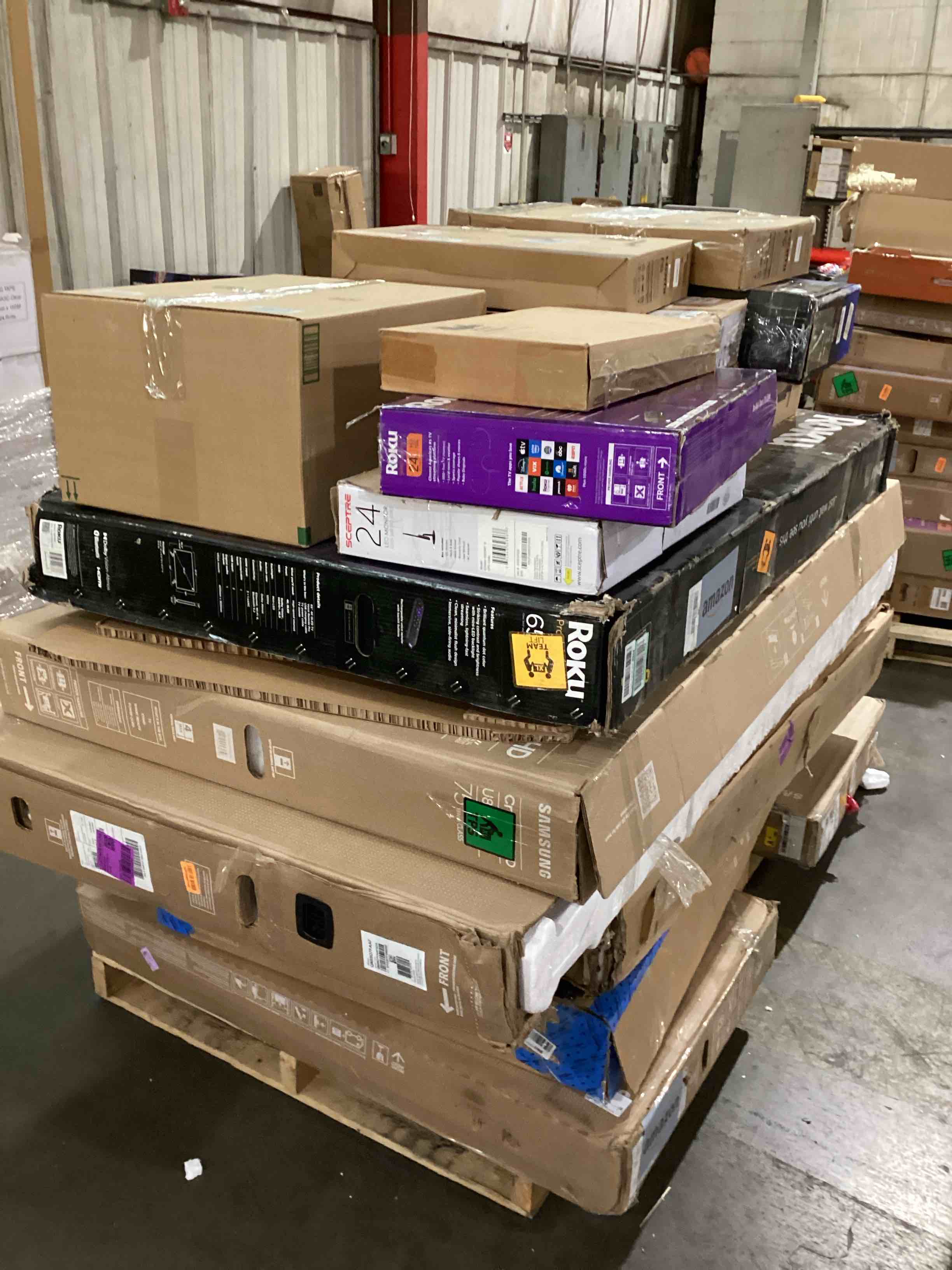 pallet of broken tvs and monitors 