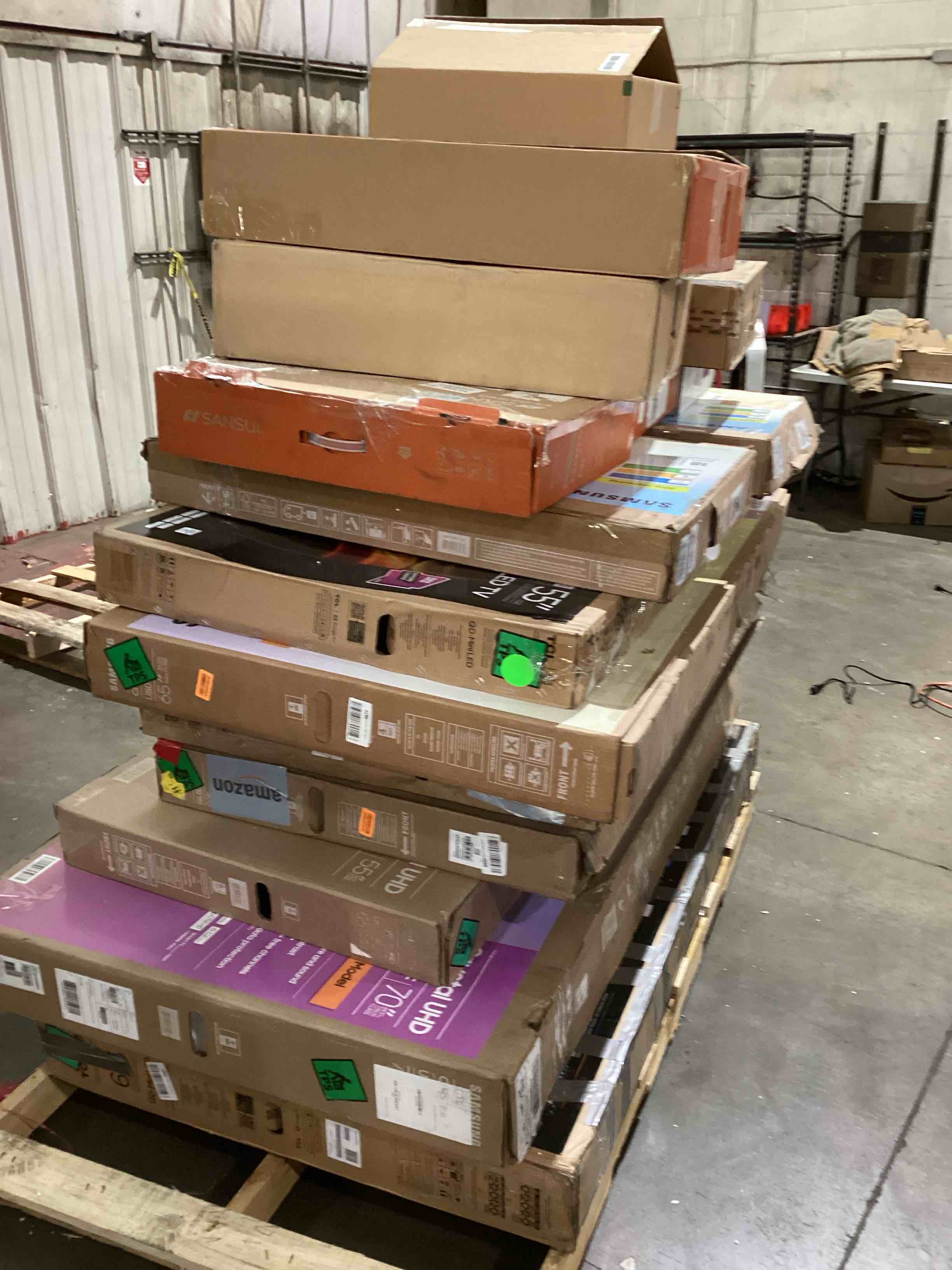 Condition photo showing As Is for pallet of broken TVs and monitors 