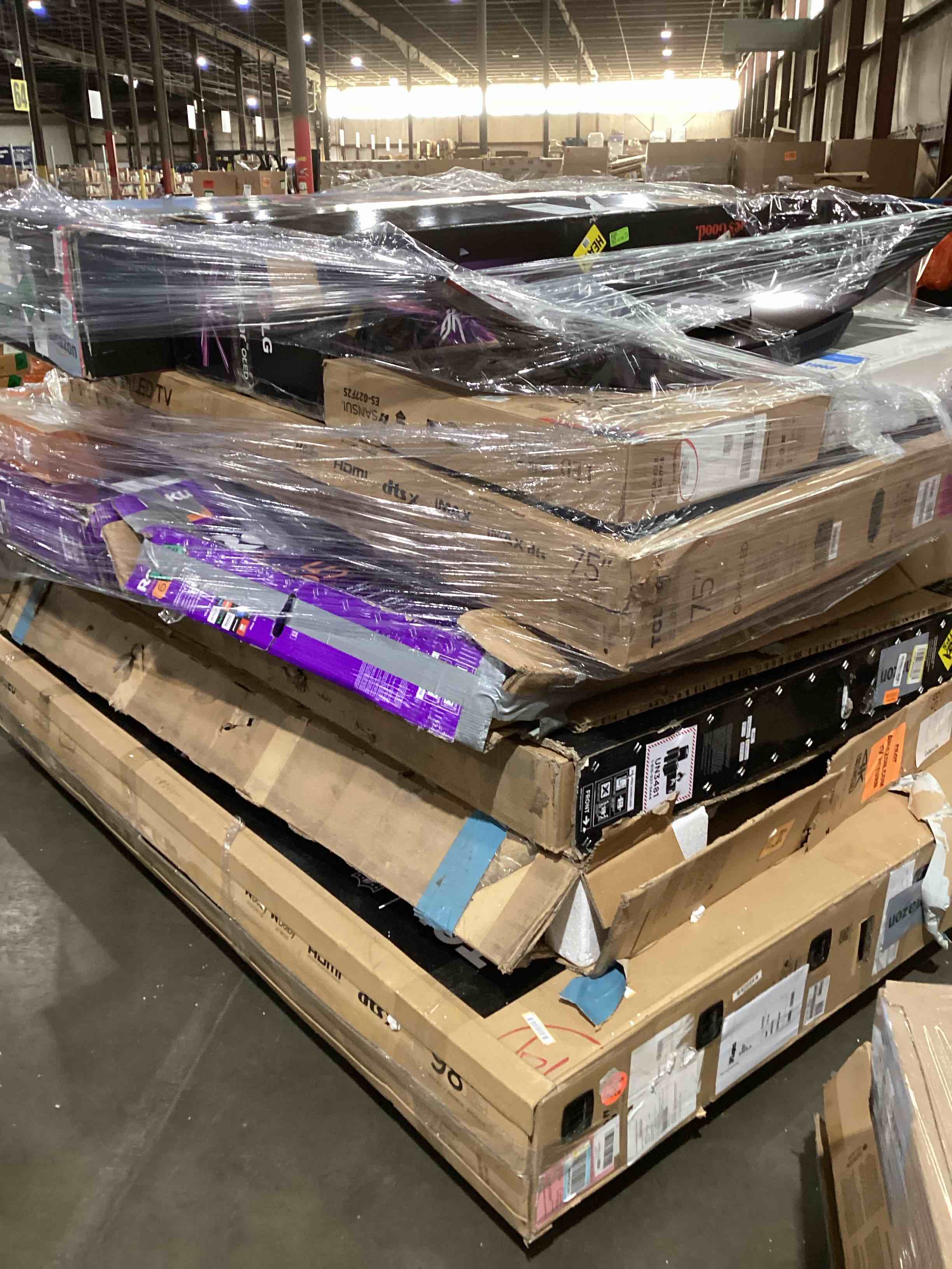 pallet of broken TVs and monitors 